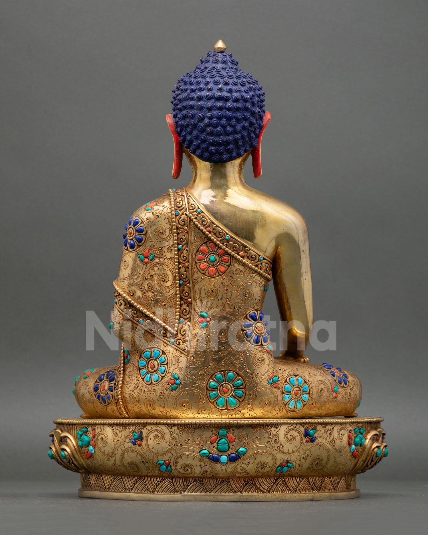 Back view of Shakyamuni Buddha statue intricate detailing, copper Buddhist art Nepal handcrafted spiritual sacred sculpture