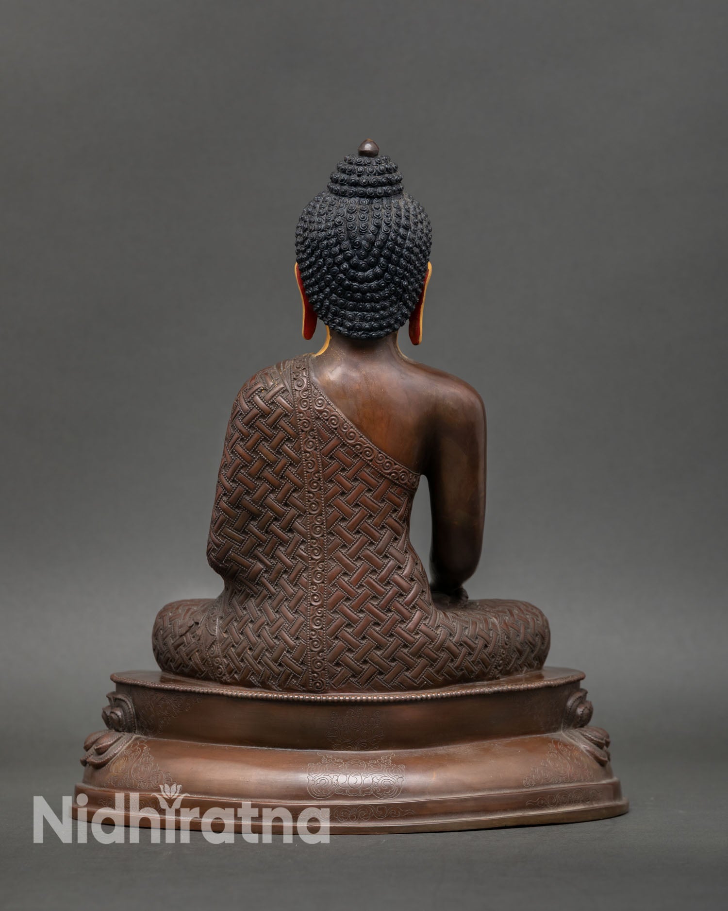 Back view of Shakyamuni Buddha statue, oxidized finish, detailed robes, lotus pedestal, handmade Nepal Buddhist sacred art