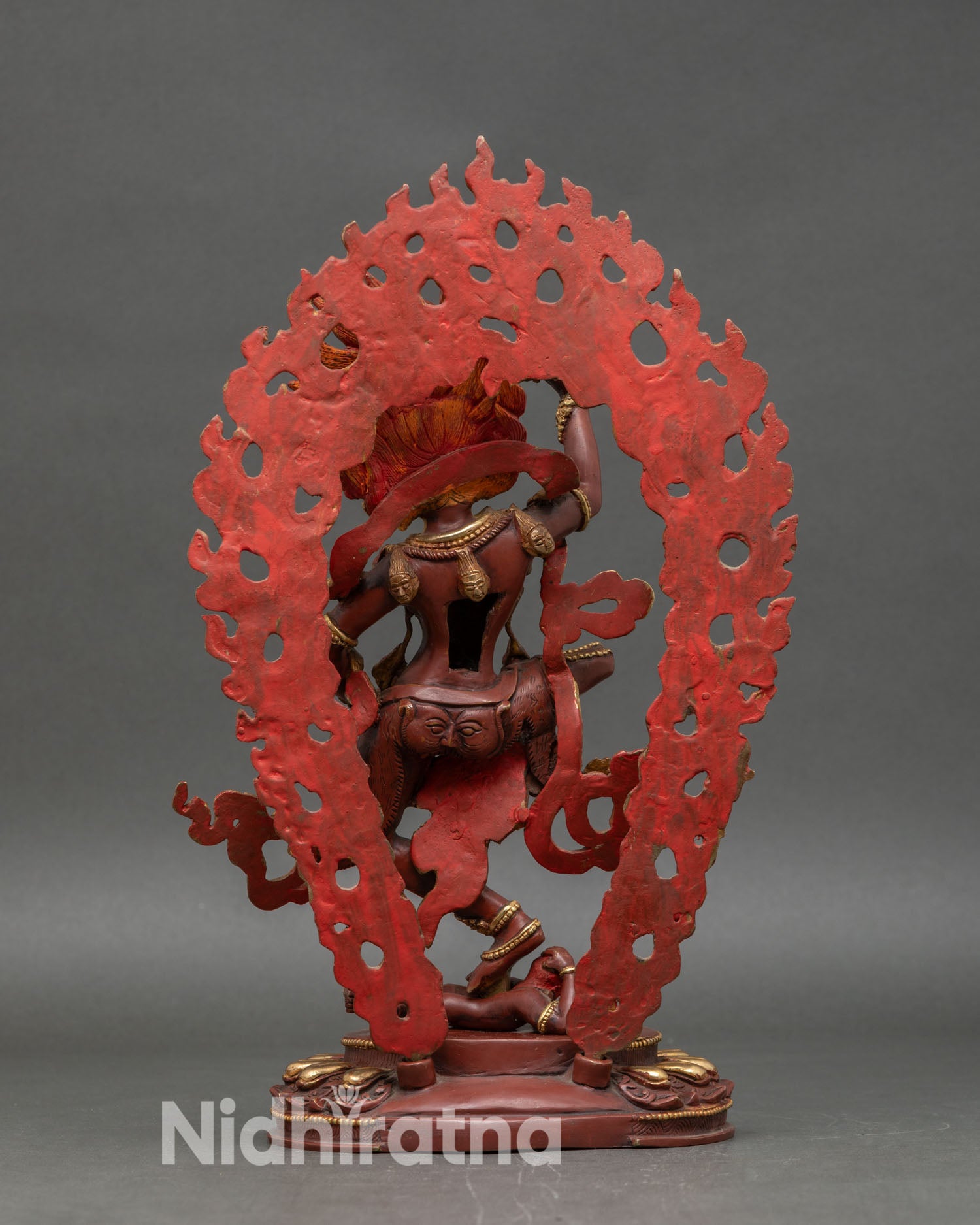 Back view of Simha Mukha statue intricate halo lotus pedestal gold accents Nepalese sculpture