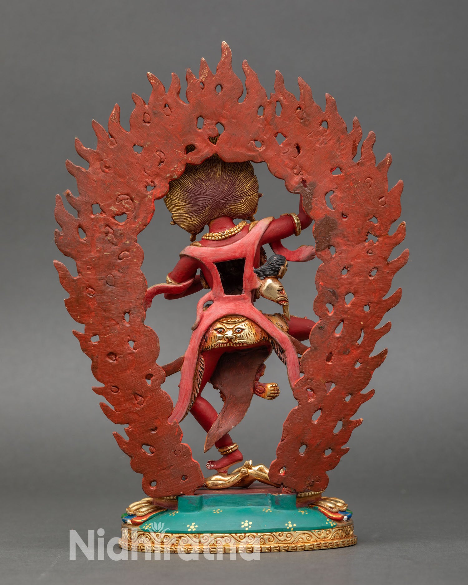 Back view of Troma Nagmo buddhist dakini with intricate halo and copper decor