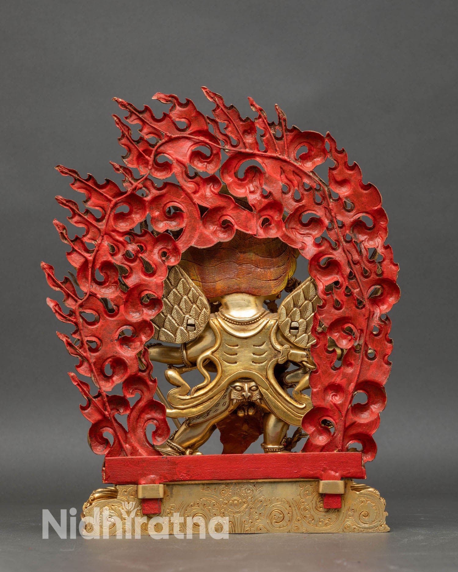 Back view of Vajrakilaya statue set against a flaming halo, perfect for meditation and altar decor.