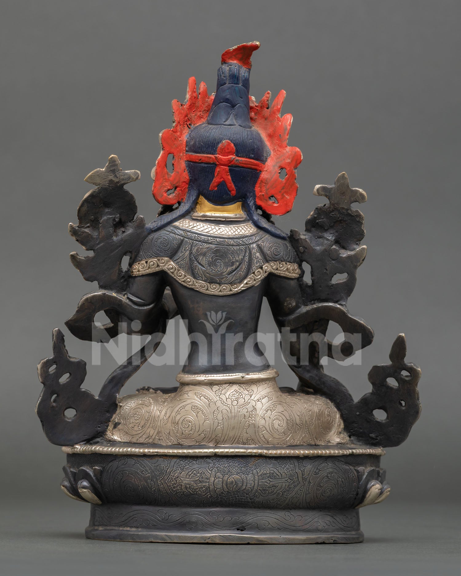 Back view of White Tara Buddhist statue, craftsmanship from Patan Nepal, highlighting traditional Himalayan artistry.