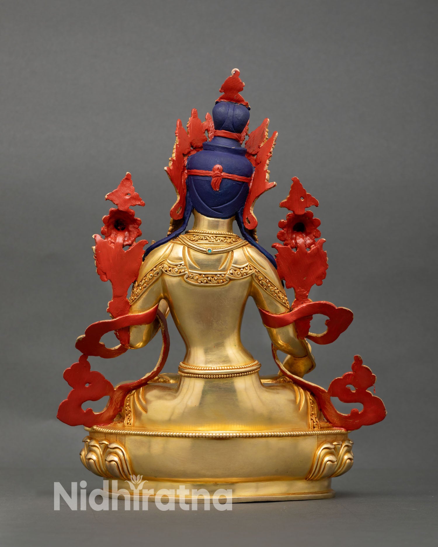 Back view of White Tara sculpture with detailed copper carving and traditional Himalayan artisan work