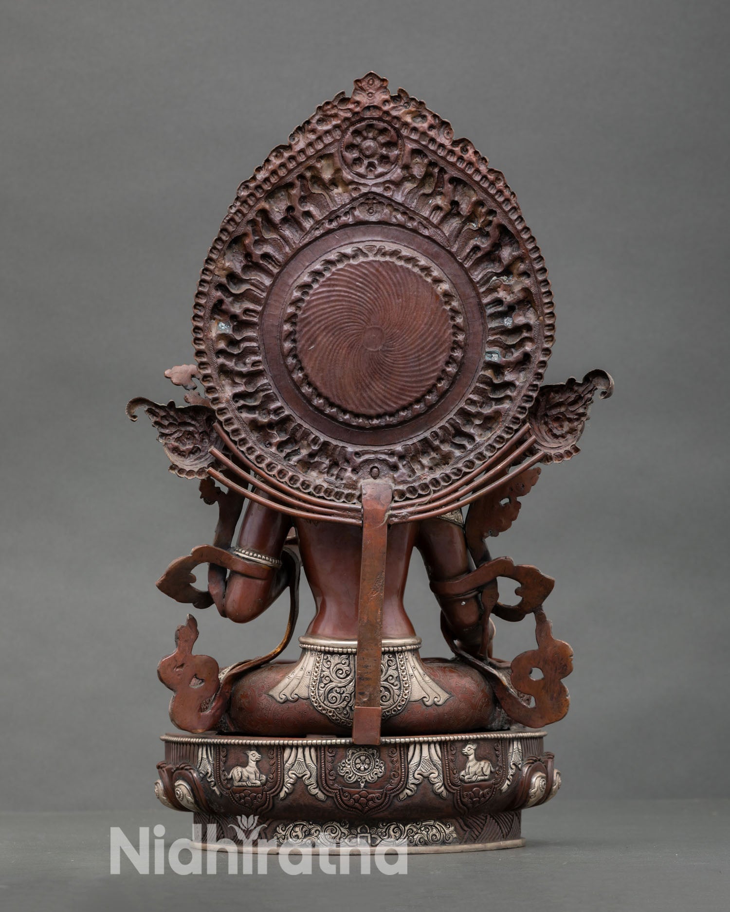 Back view White Tara statue handcrafted in copper with oxidized silver plated finish, radiant halo and intricate Himalayan artistic detailing