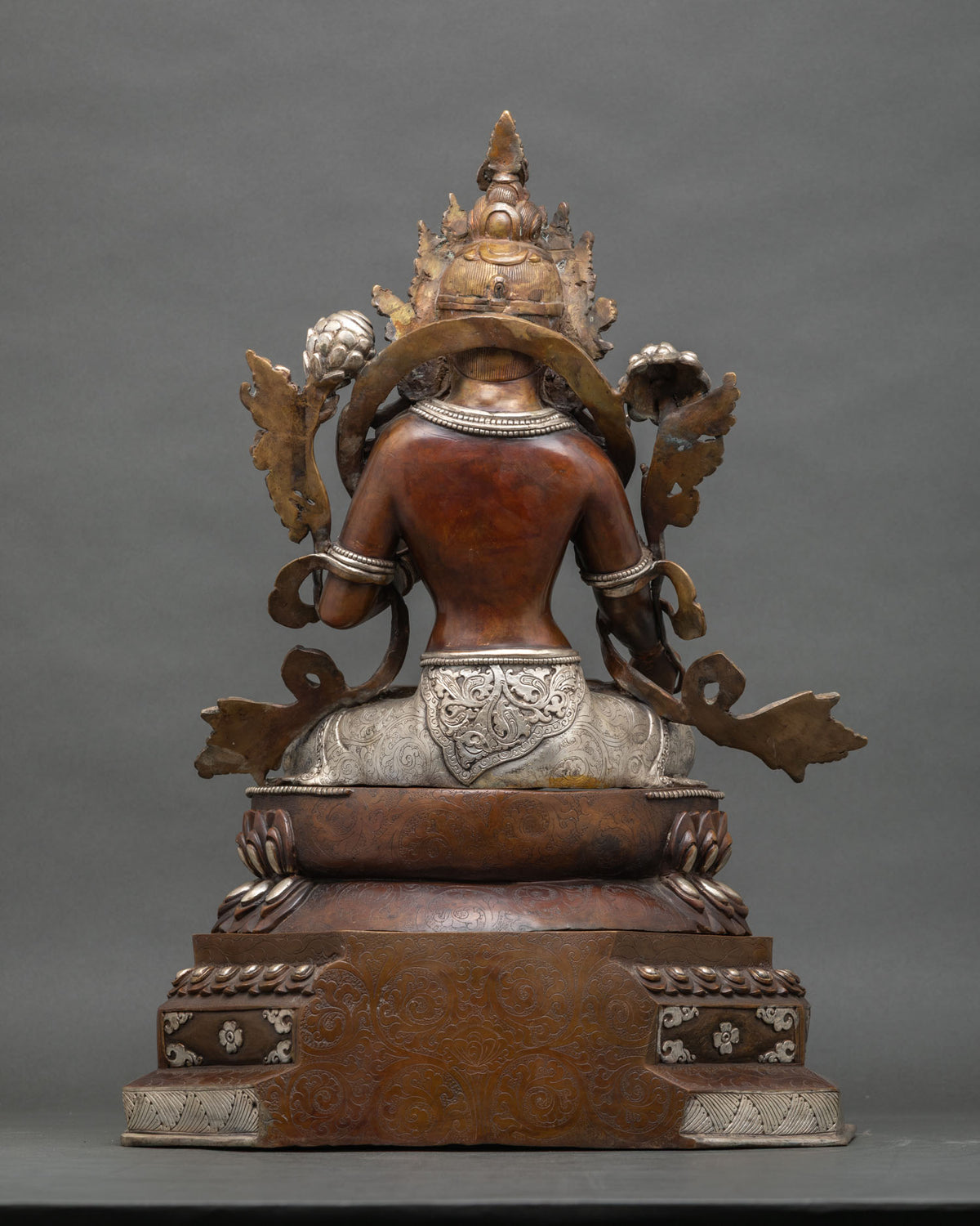 Back view White Tara statue showing flowing robes and double lotus pedestal