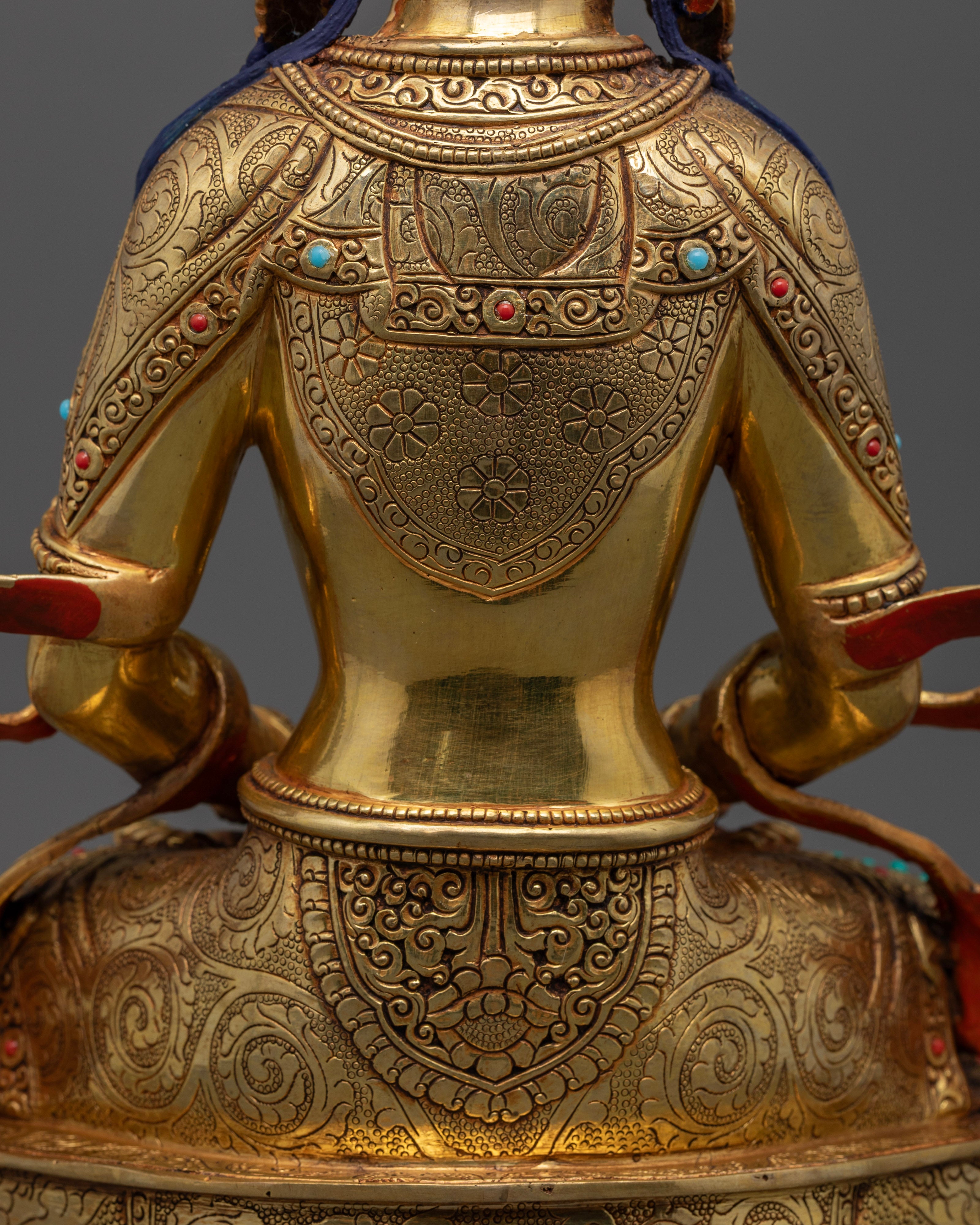 back profile of intricately carved amitayus buddha statue