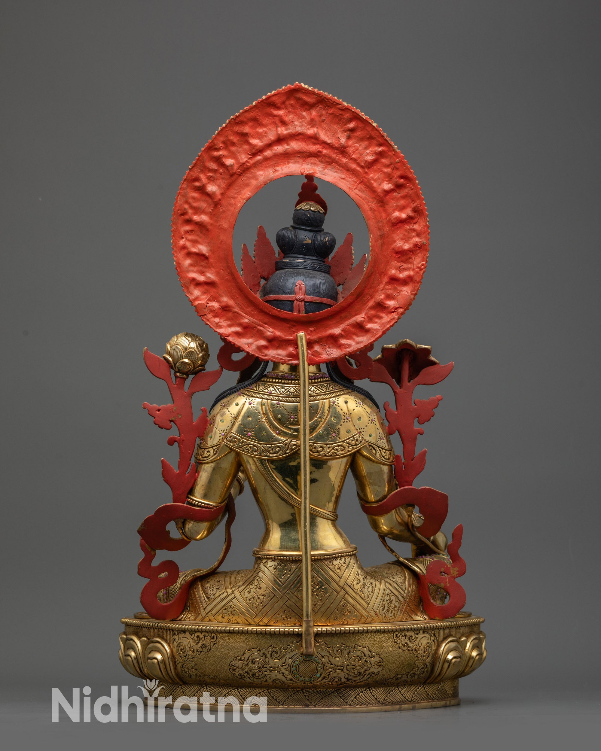 back view Green Tara statue showing halo, detailed robe folds and lotus pedestal