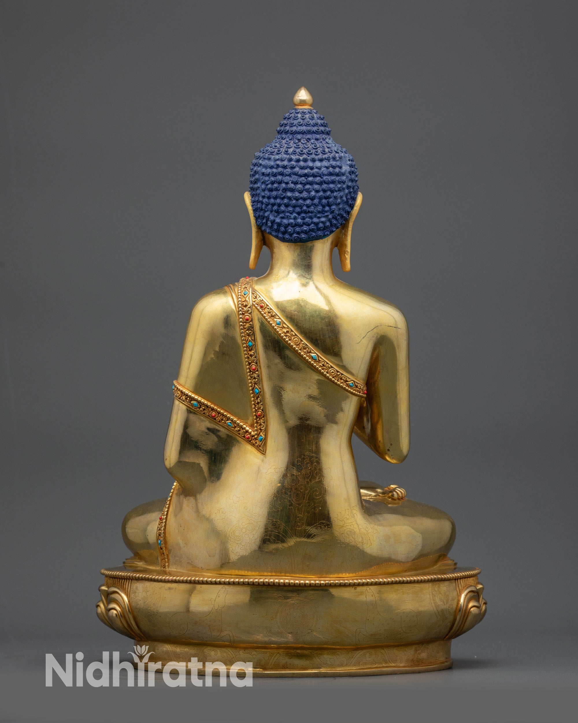 back view Suvarna Bhadra Vimala statue showing robe details and smooth polished finish