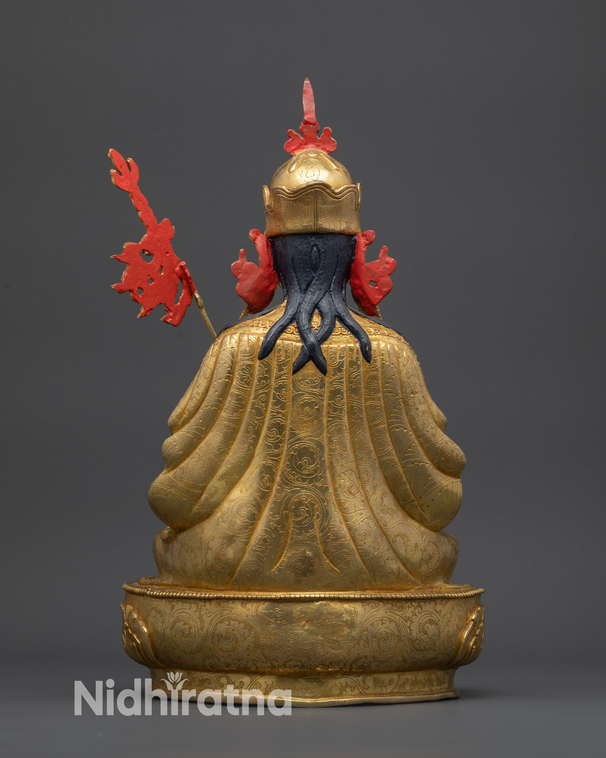 back view Tsokye Dorje statue showing khatvanga staff and detailed robe engravings