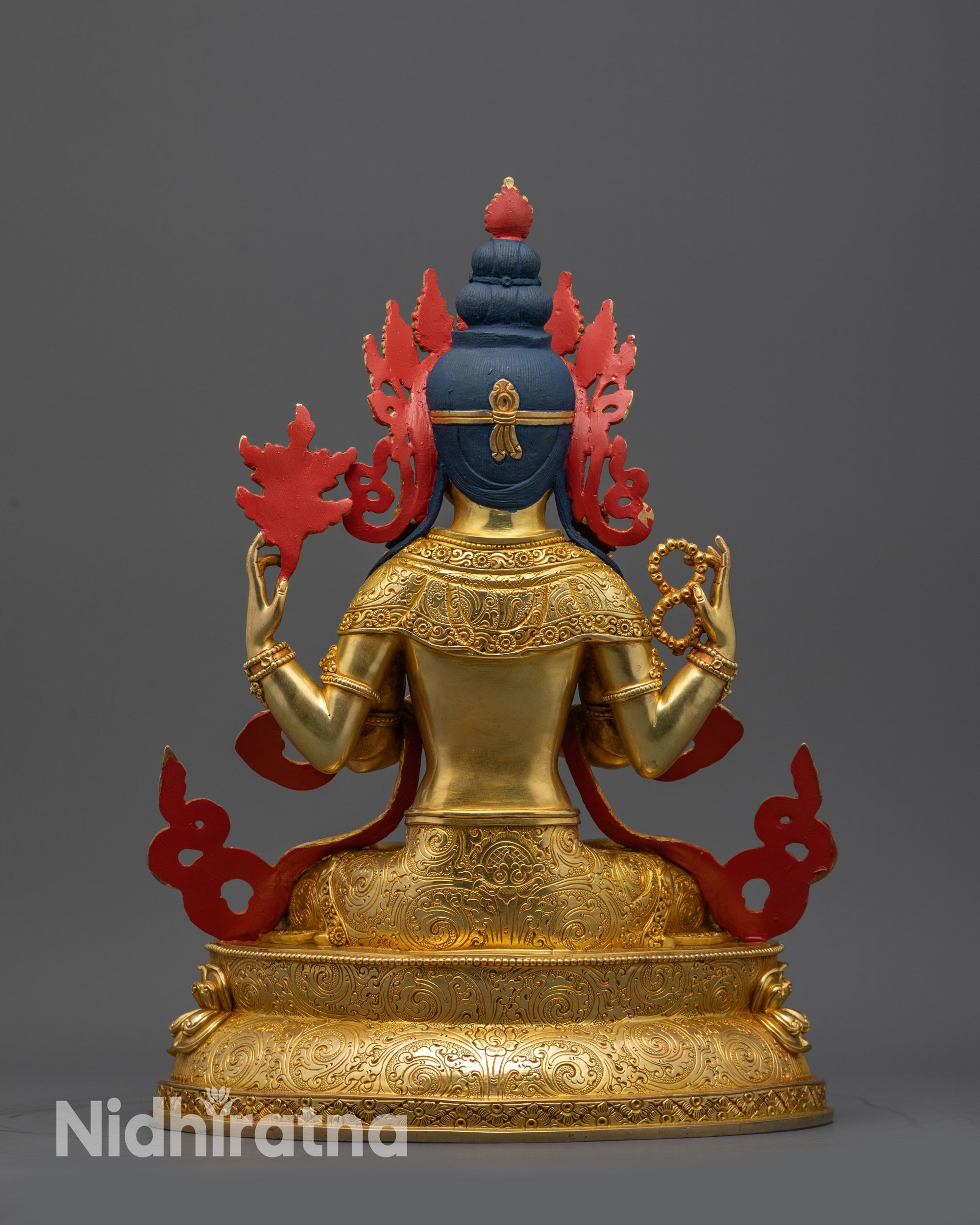 back view gold-gilded Avalokiteshvara statue with detailed robe patterns and sacred design