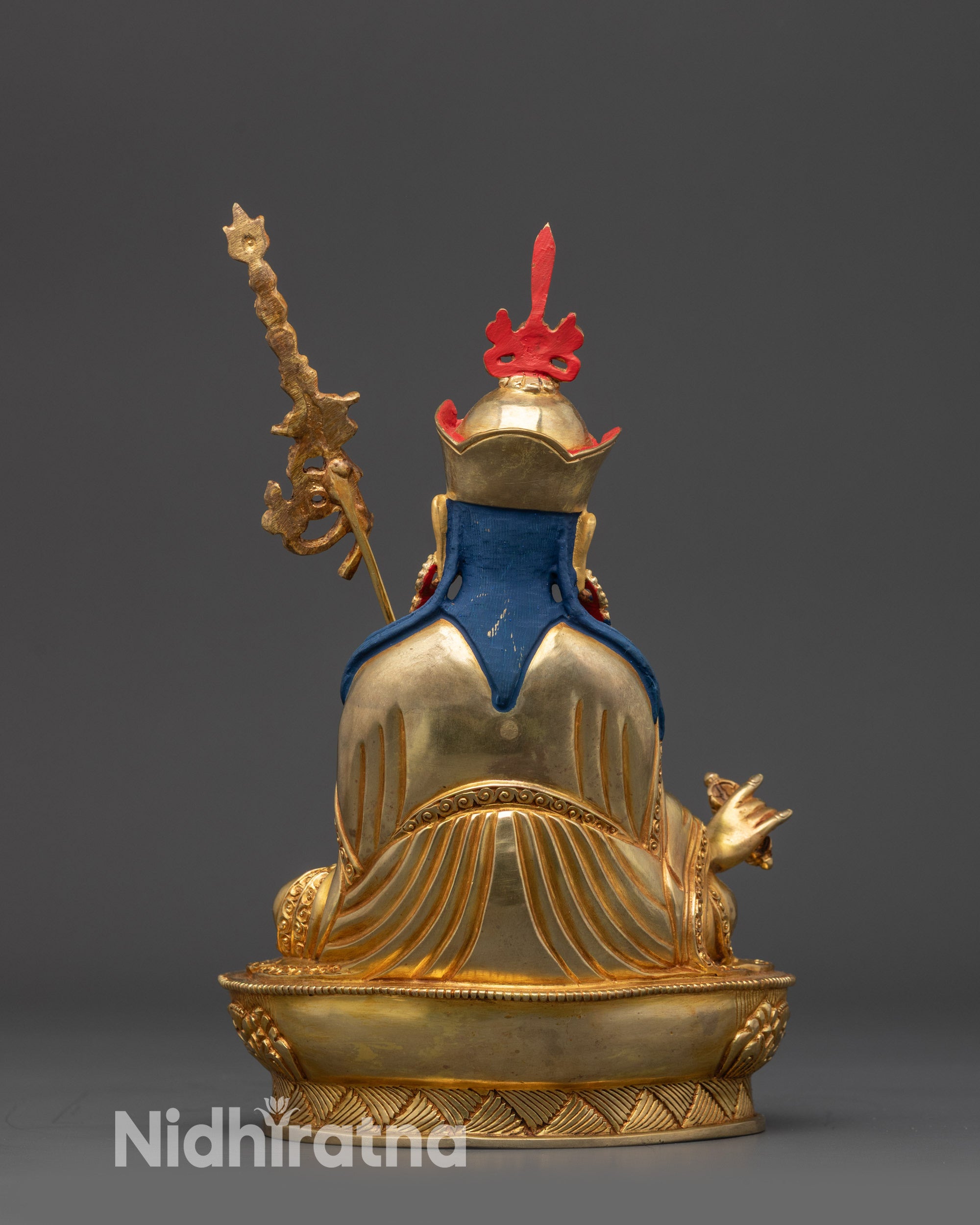 back view hand-carved Padmasambhava statue showing detailed robe and polished finish