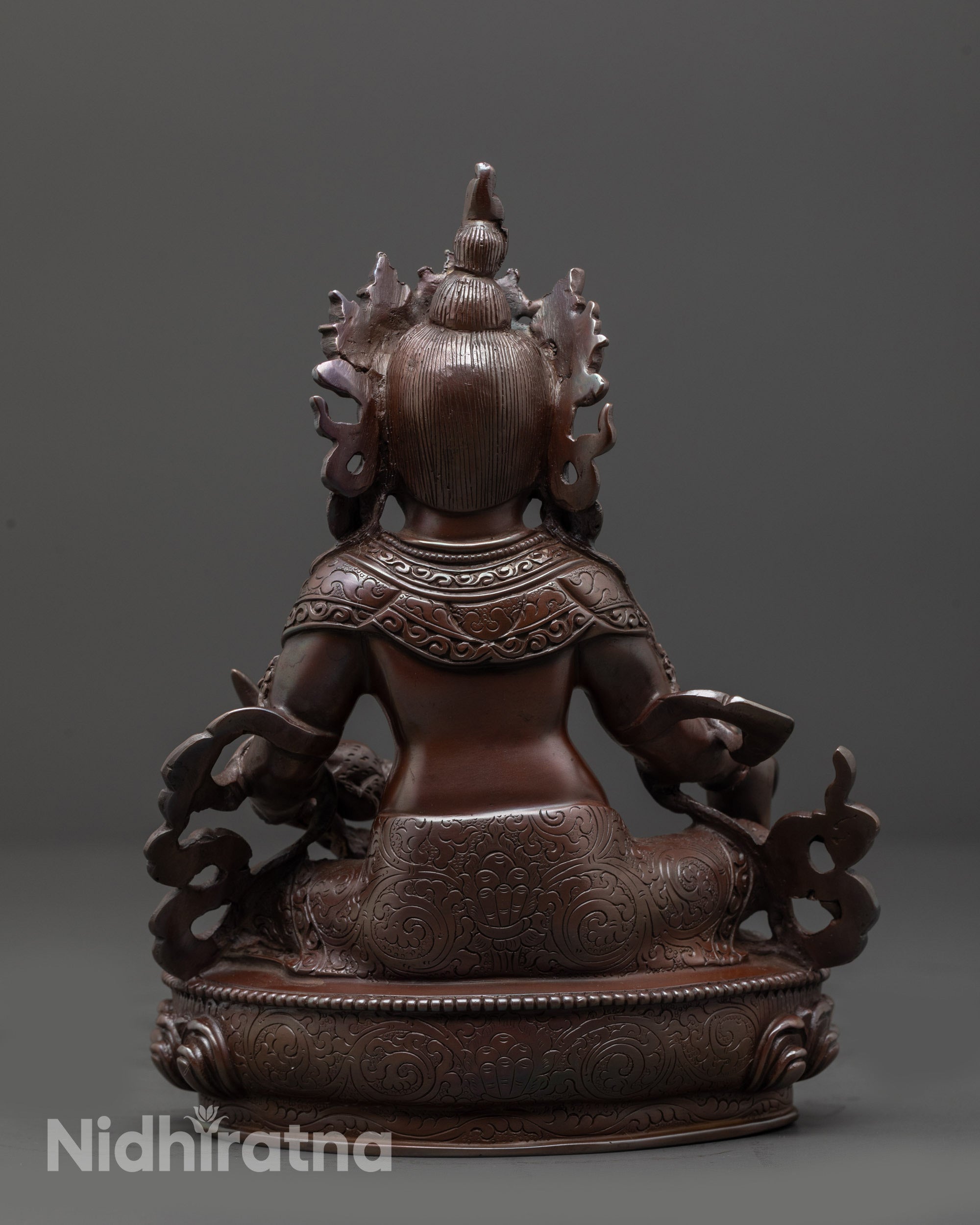 back view of Dzambhala Statue highlighting craftsmanship and earthy brownish hue