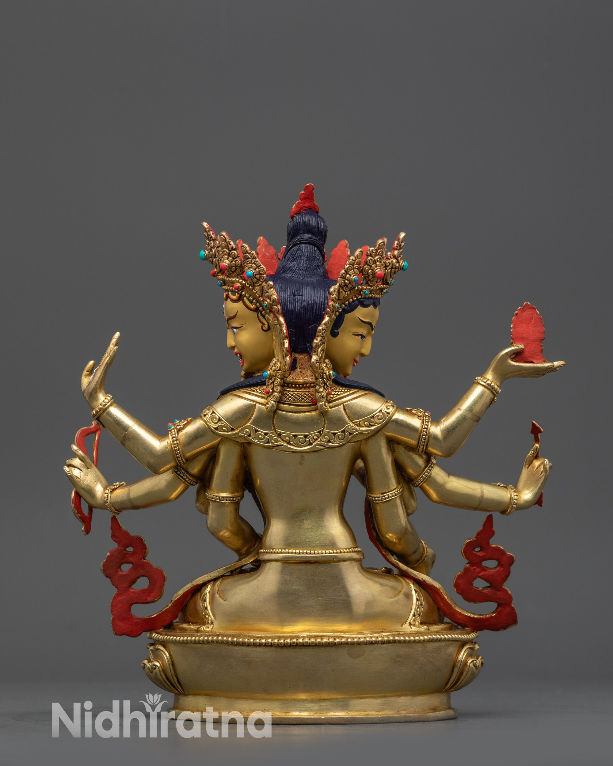 back view of Namgyalma statue displaying robe patterns and lotus base carving