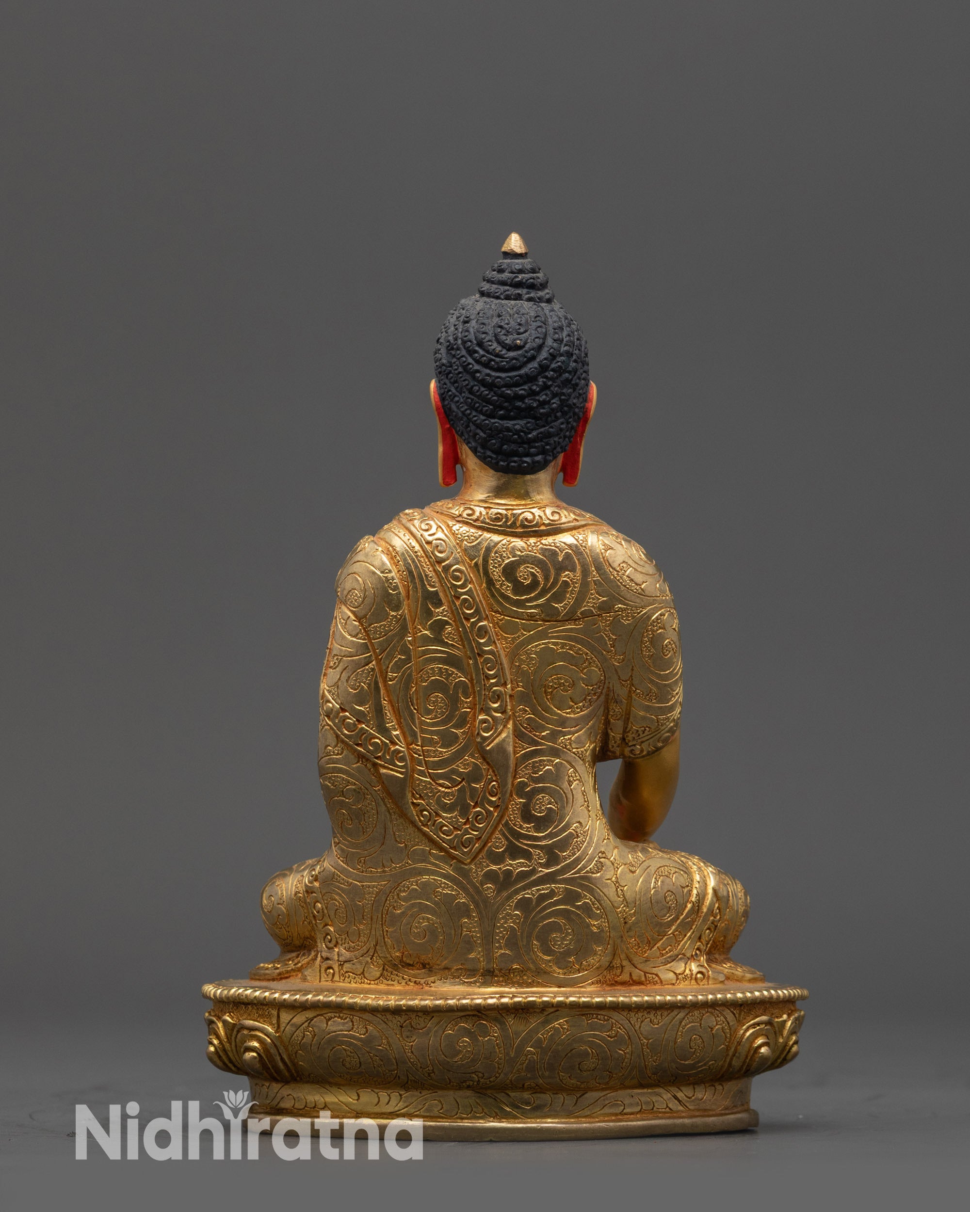 back view of Shakyamuni Buddha Statue highlighting detailed lotus seat and robe patterns
