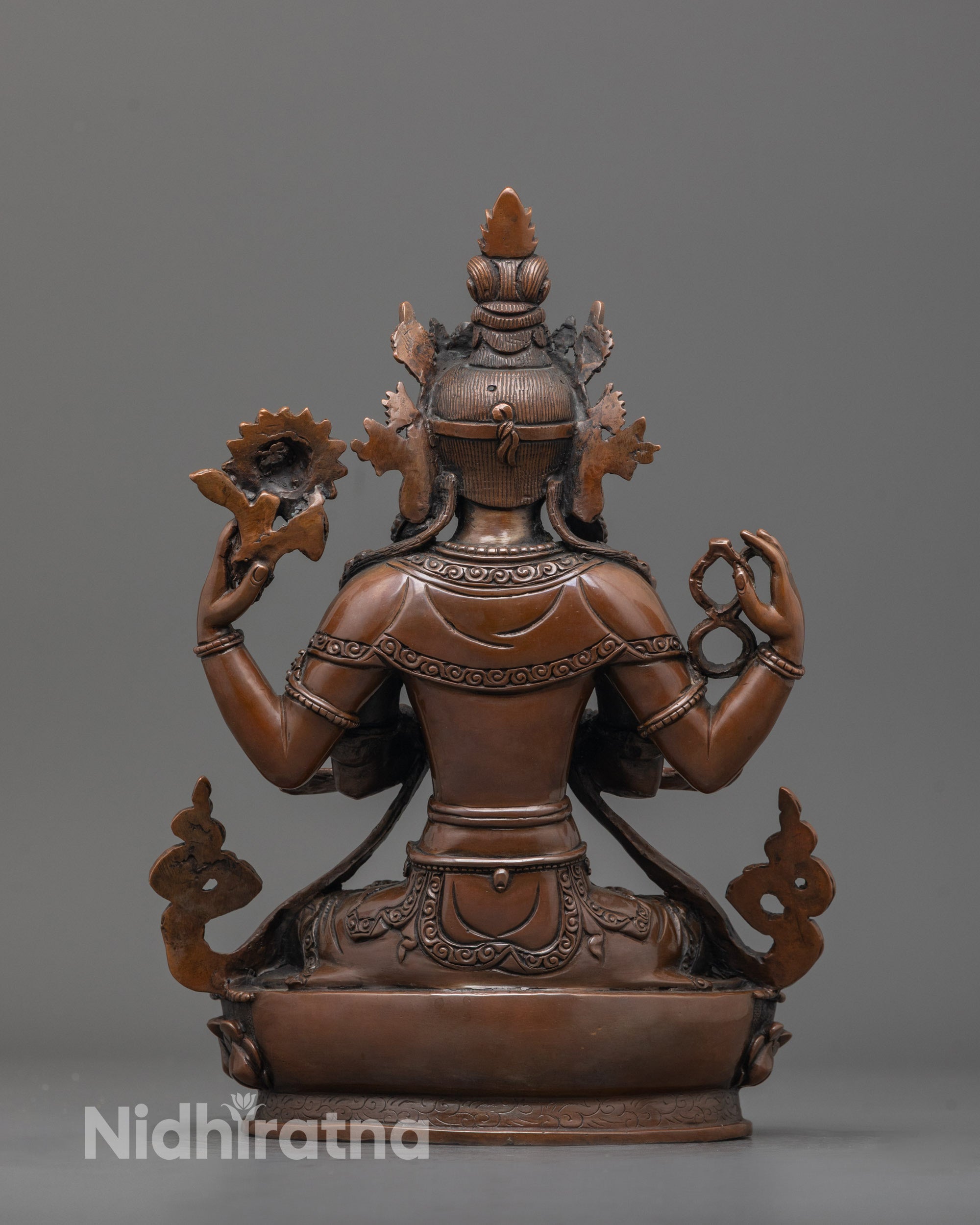 back view of chenrezig statue highlighting oxidized copper finish and fine craftsmanship