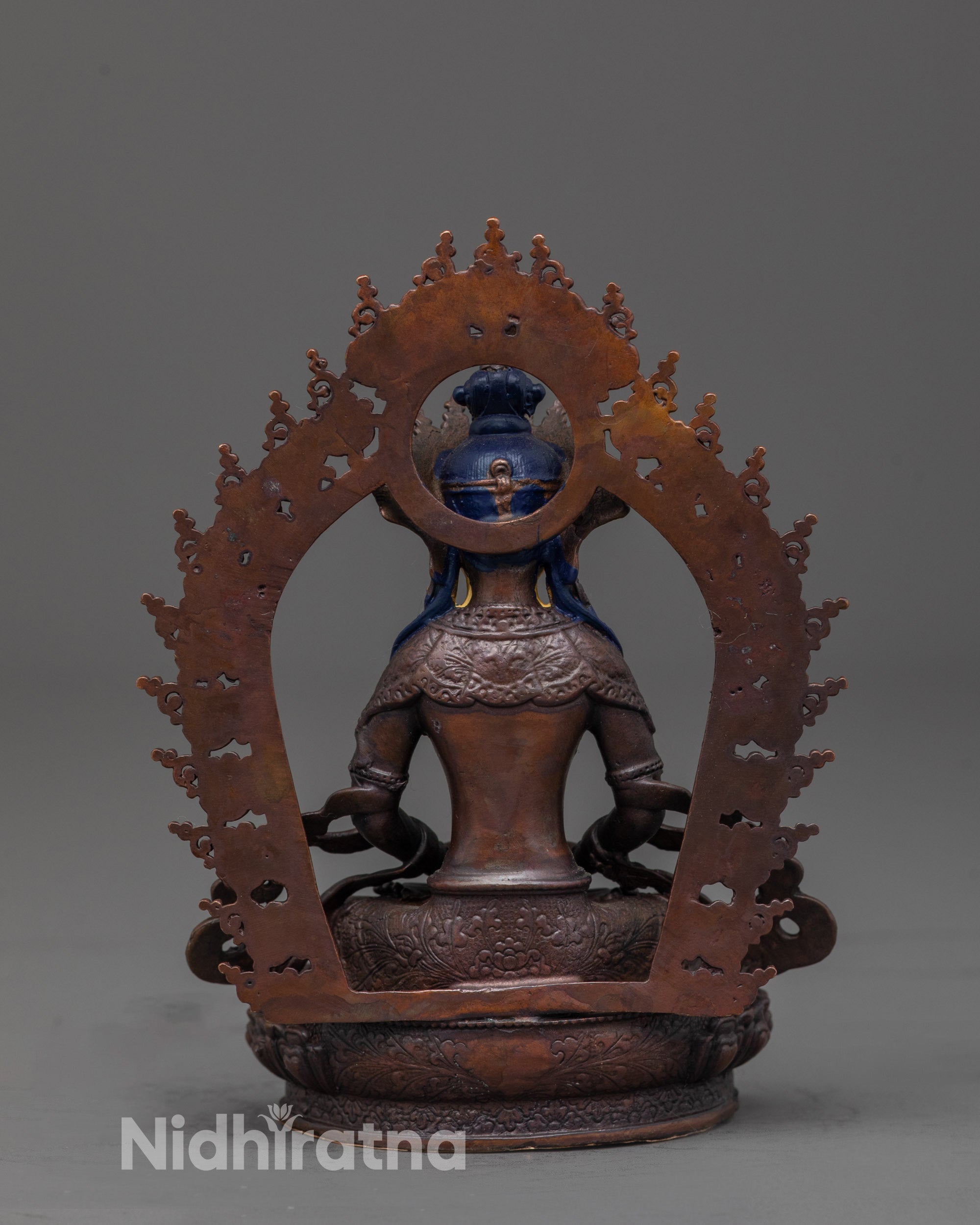 back view of machine-made amitayus statue showing halo and robe craftsmanship