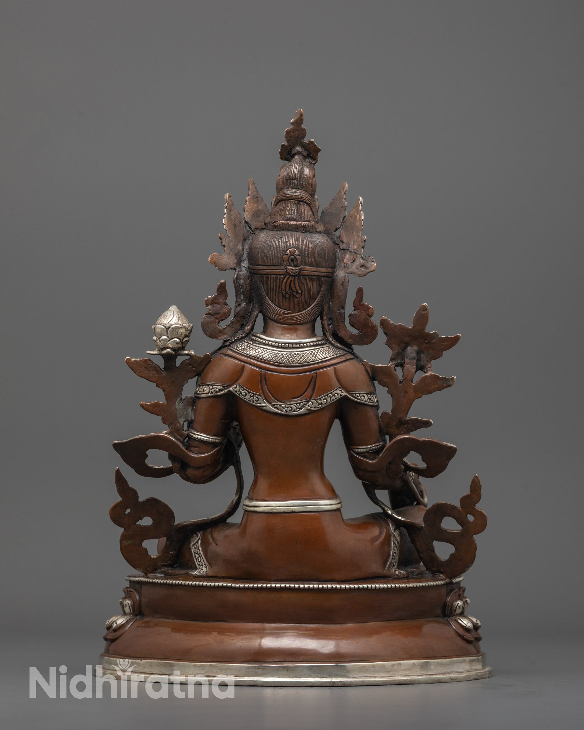 back view of oxidized copper green tara statue highlighting handcrafted lost wax detailing