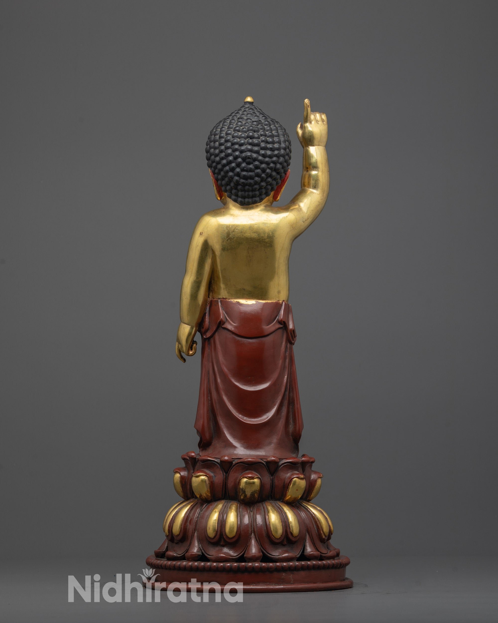 back view of partially gold gilded little buddha statue with lotus seat design