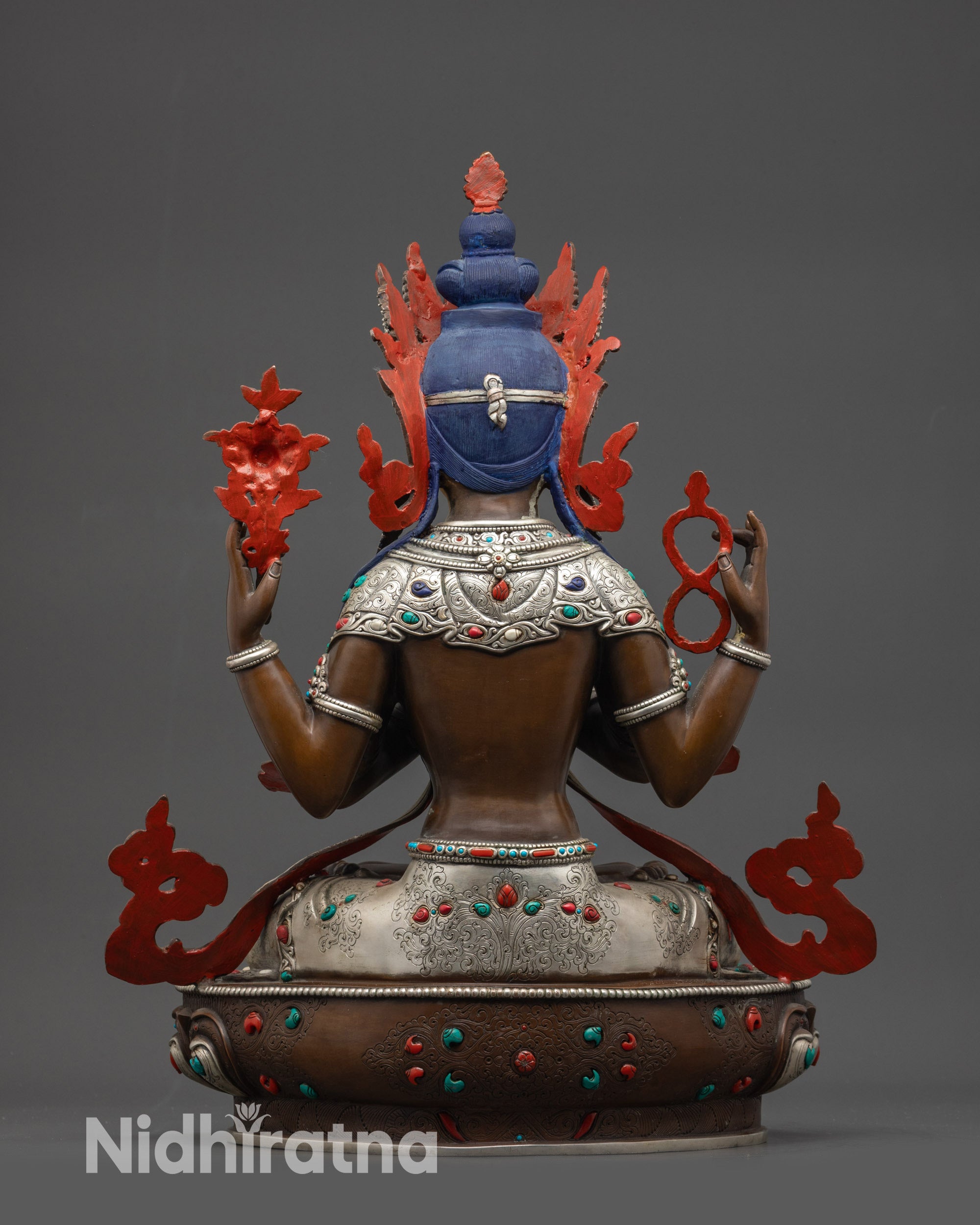 back view oxidized Chenrezig statue showing robe, lower garments, and semi-precious stone details