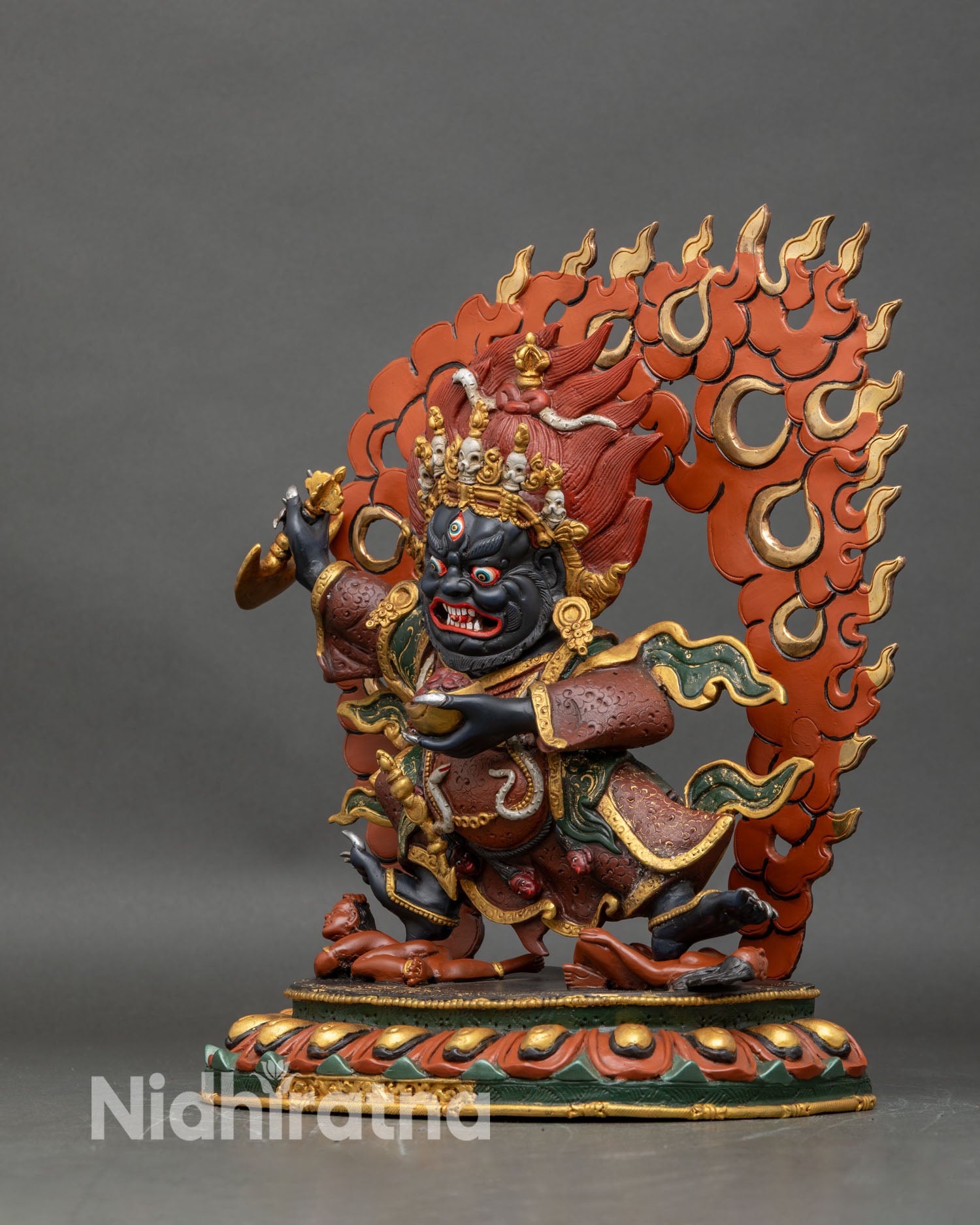 Left side view of Black Cloak Mahakala Bernagchen statue with layered robes and ornaments