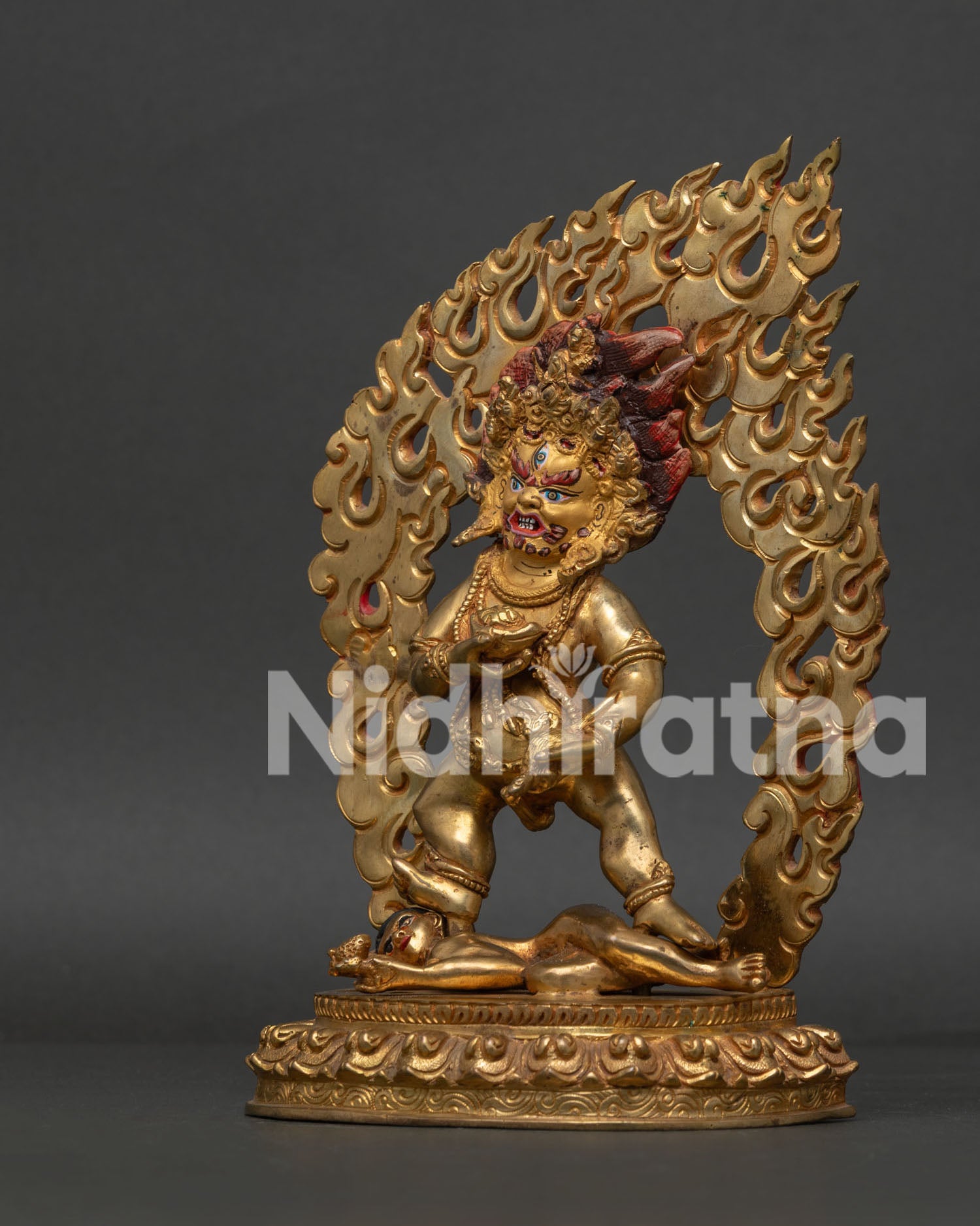 Black Dzambhala Side View Holding Jewel Spitting Mongoose and Kapala with Nectar.