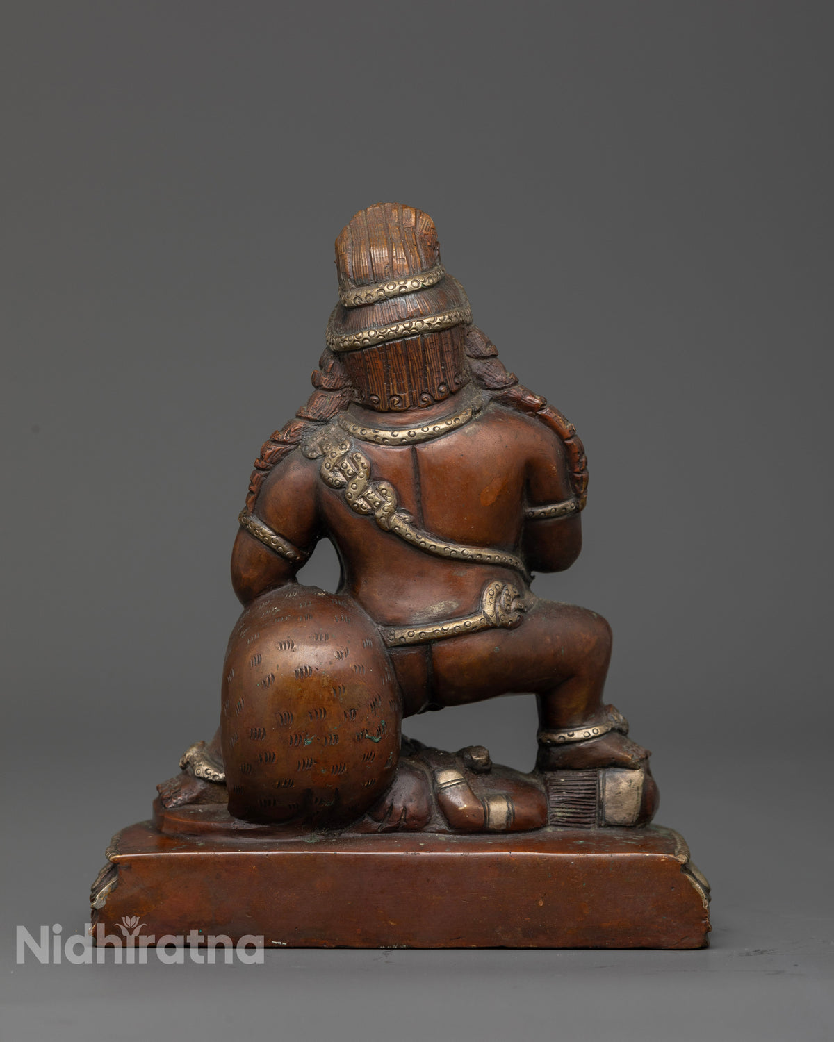 Black Dzambhala statue symbolizing protection wealth and prosperity.