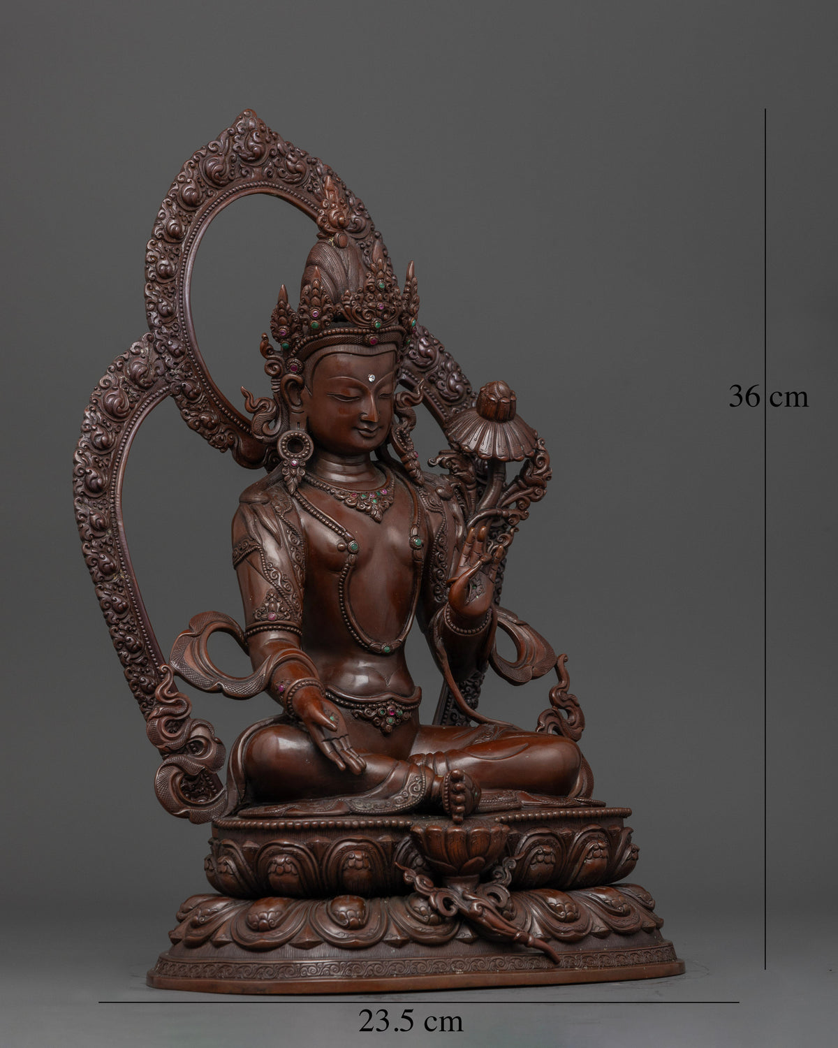 Bodhisattva seated on ornate double lotus base with jeweled crown and celestial garments