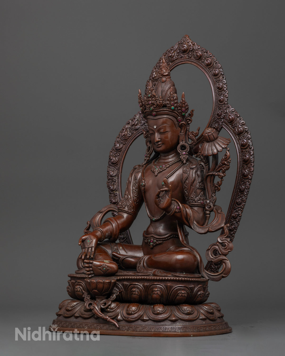 Bodhisattva Statue showing Varada Mudra and blossoming lotus symbolizing compassion and awakening