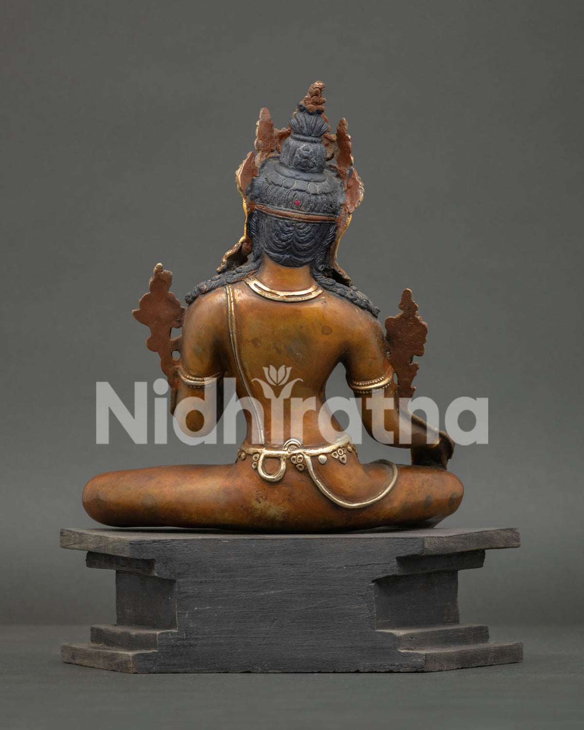 Buddhist Bodhisattva Statue from Patan Nepal with oxidized copper details and wooden base