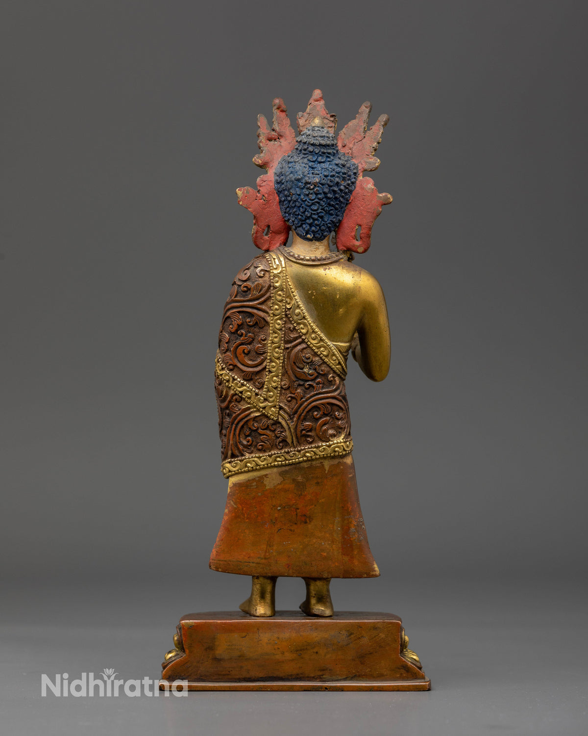 Buddhist Dipankara Buddha statue with gold gilded ornaments and detailed copper carving representing compassion, generosity, protection, and blessings.