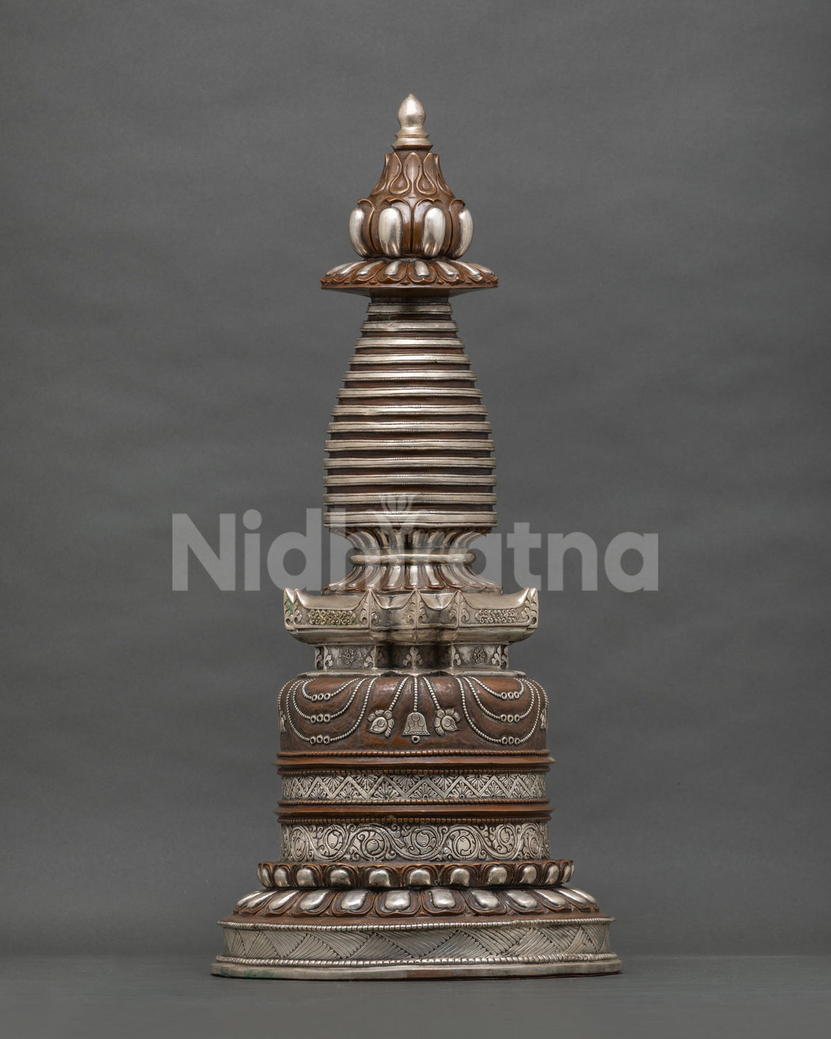 Buddhist Kadampa Stupa with intricate floral motifs and traditional Himalayan metalwork