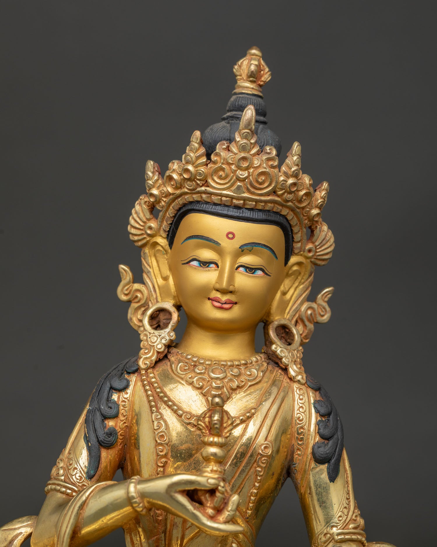 Buddhist Vajrayana purification deity with gold painted face and detailed craftsmanship