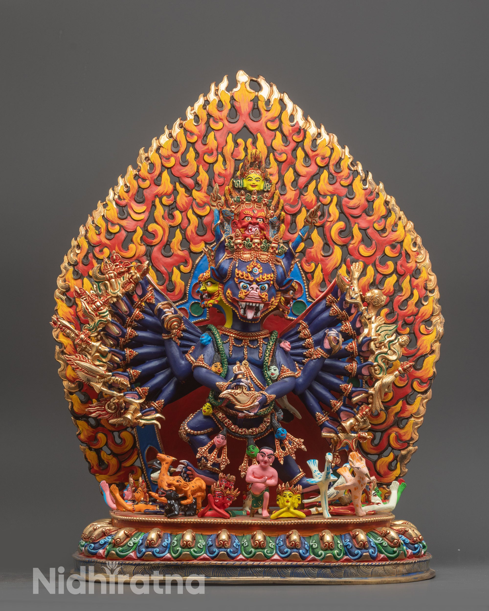 Himalayan Yamantaka Statue front view in purple hues with nine faces and sixteen arms