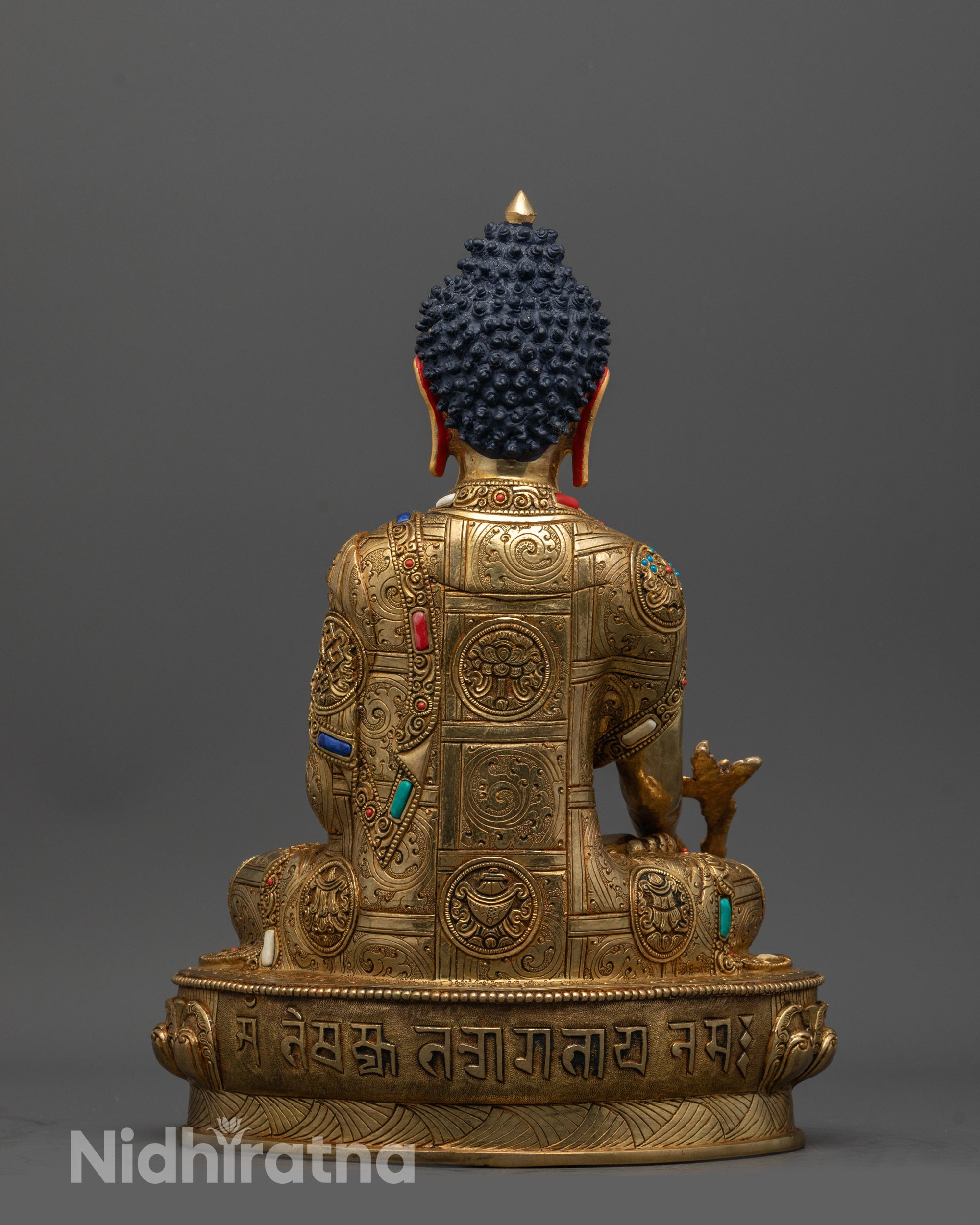 Back view of Detailed Medicine Buddha Statue highlighting engraved lotus and intricate patterns