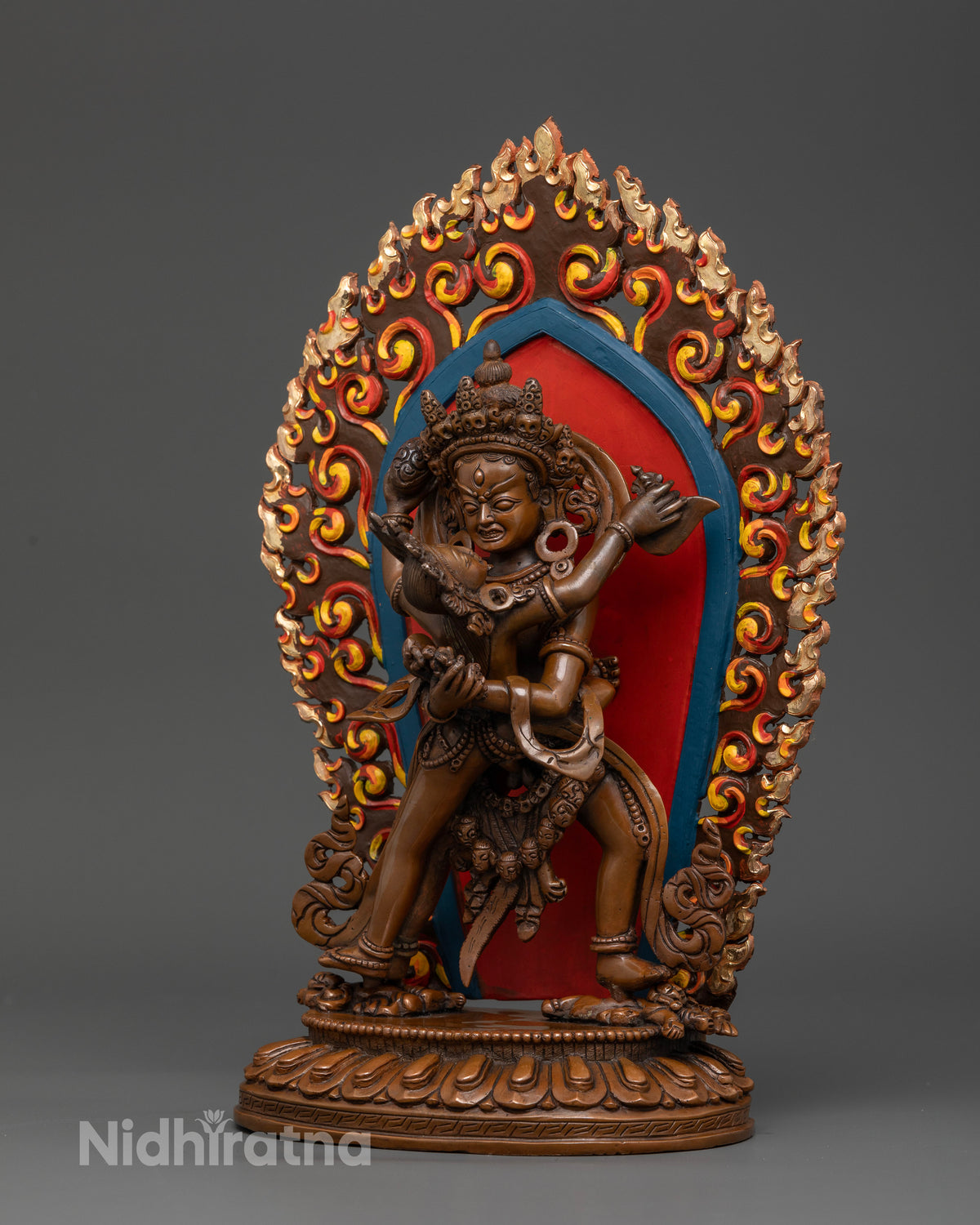 Chakrasamvara and Vajravarahi standing on subdued figures atop lotus.