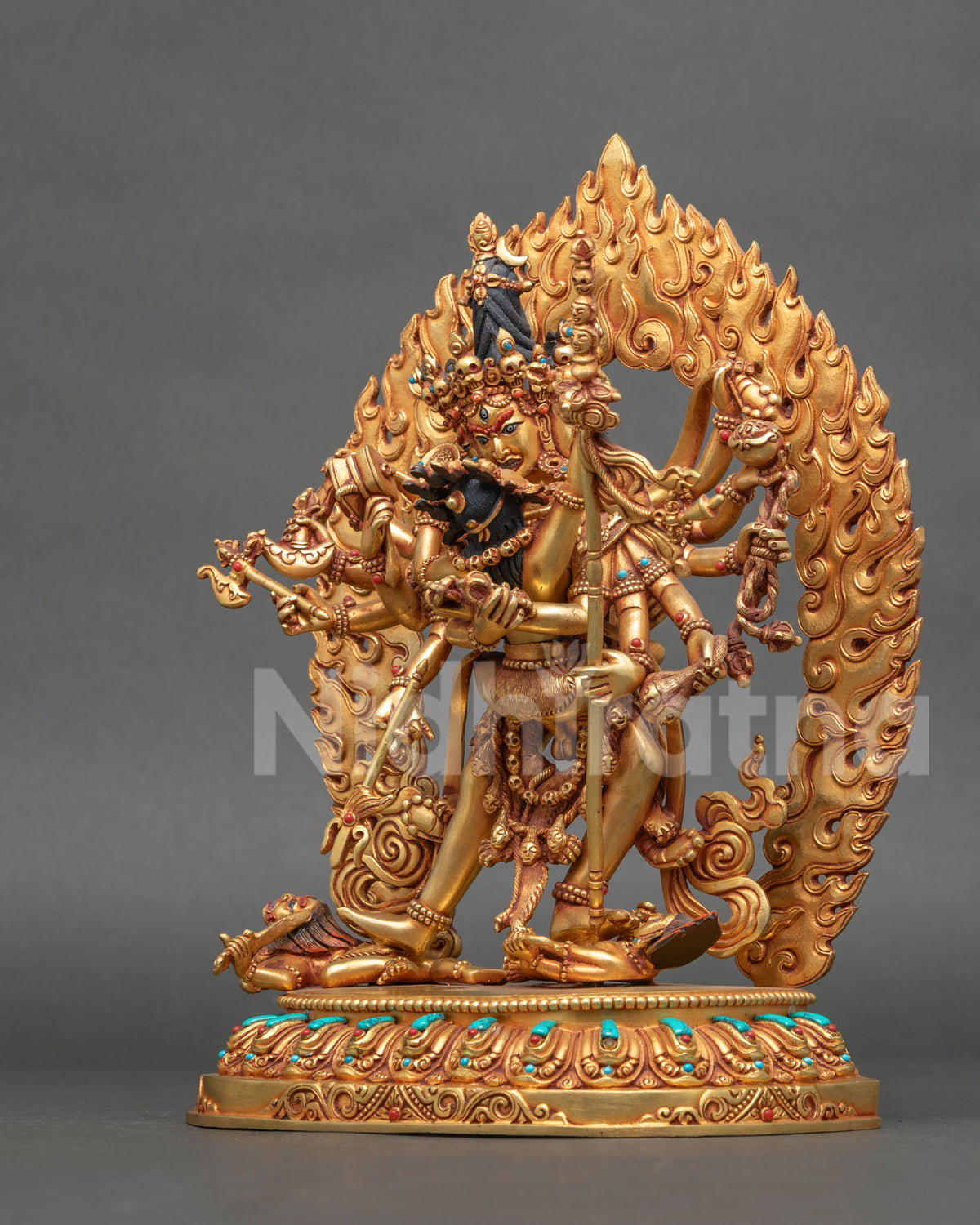 Chakrasamvara Yab-Yum statue left side view showing twelve arms and ritual implements, Nepalese art