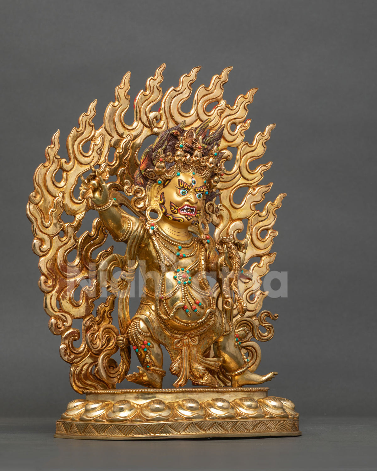 Chana Dorje statue right side view, raised vajra and flaming halo in gold fire-gilded copper