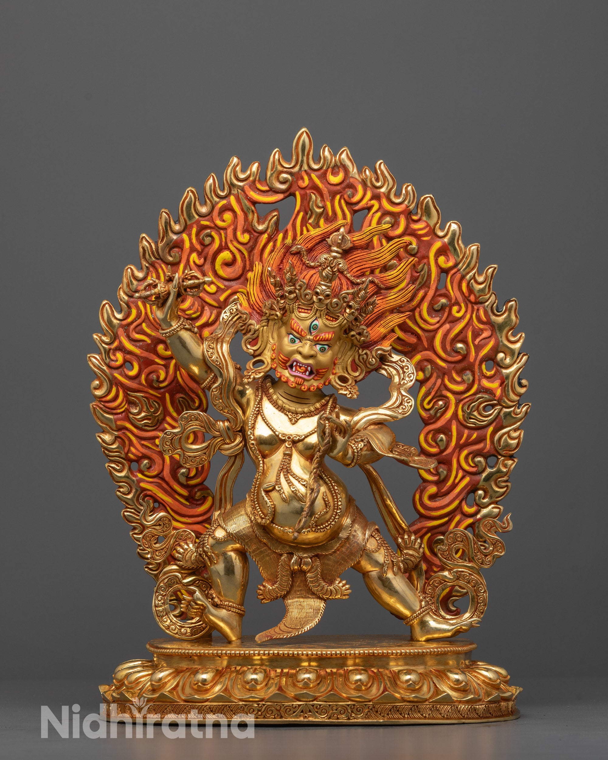 chana dorje vajrapani statue front view with wrathful gold-gilded face and fiery halo