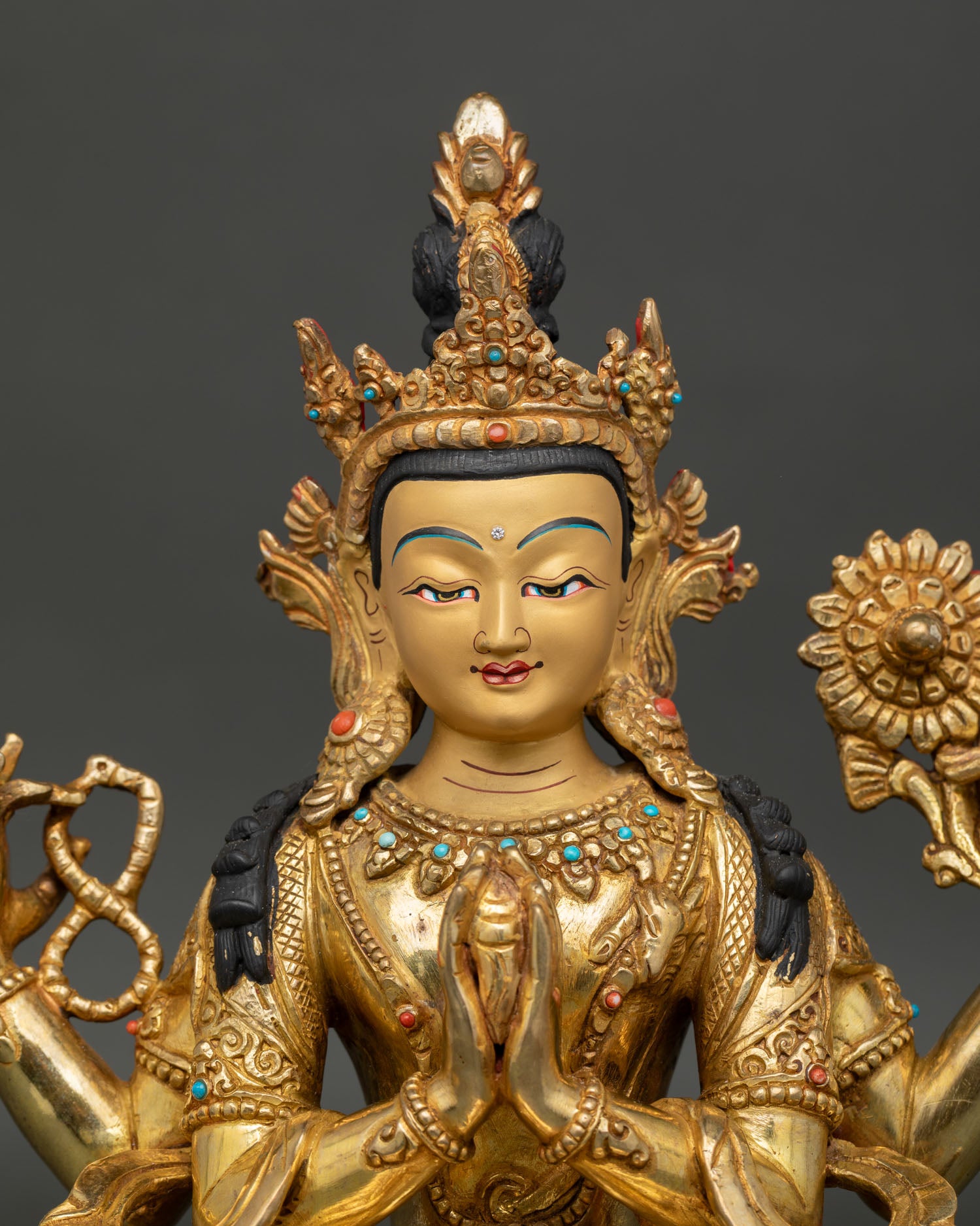 Chenrezig avalokiteshvara face with gold painted finish and sacred craftsmanship.
