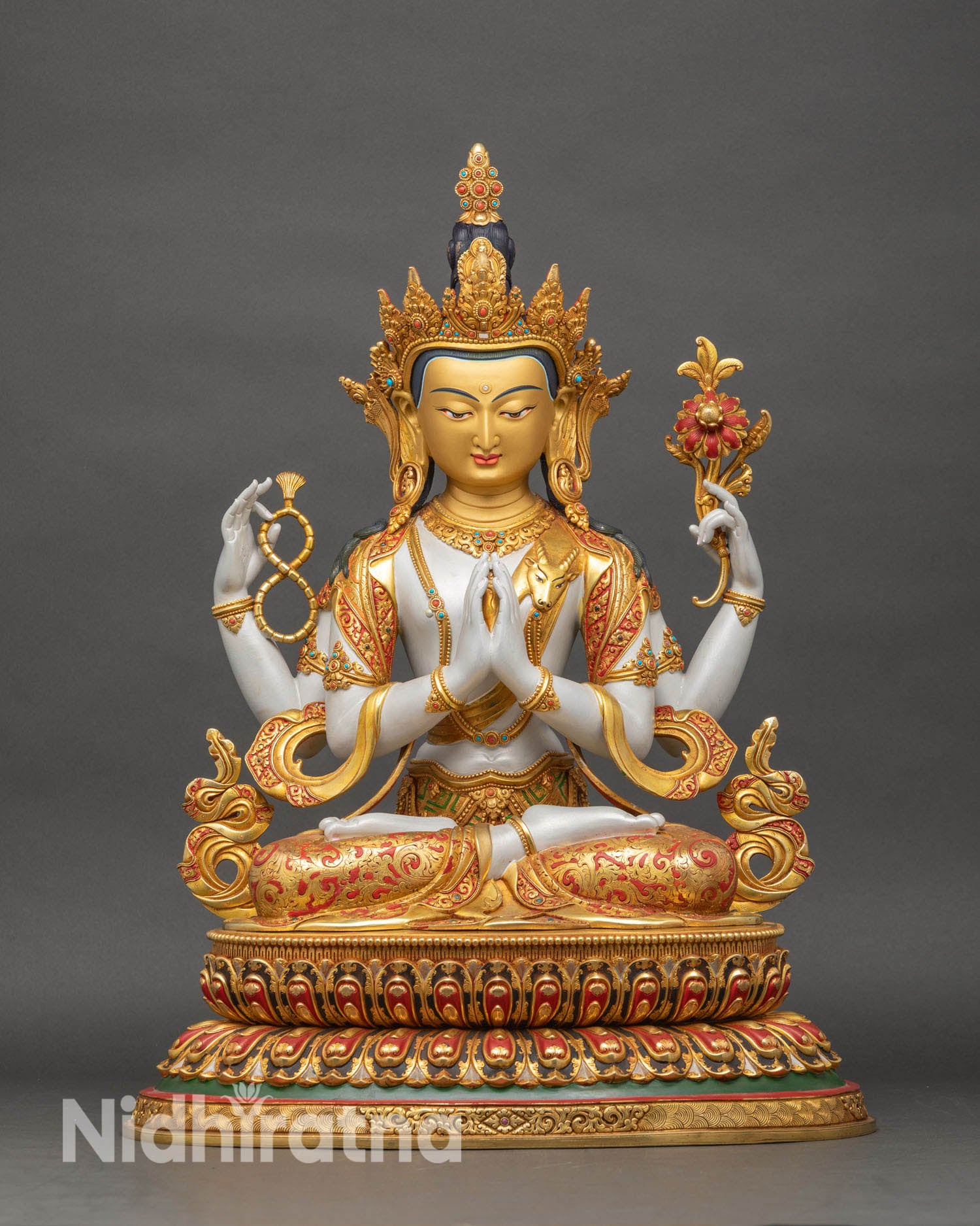 Chenrezig Avalokiteshvara statue front view, four arm Tibetan Buddhist deity in gold and copper