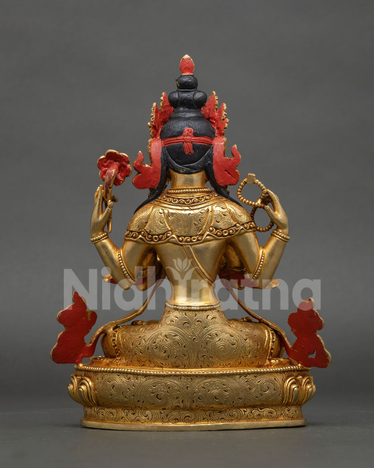Chenrezig Statue back view gold fire gilded copper Newari art Patan Nepal.