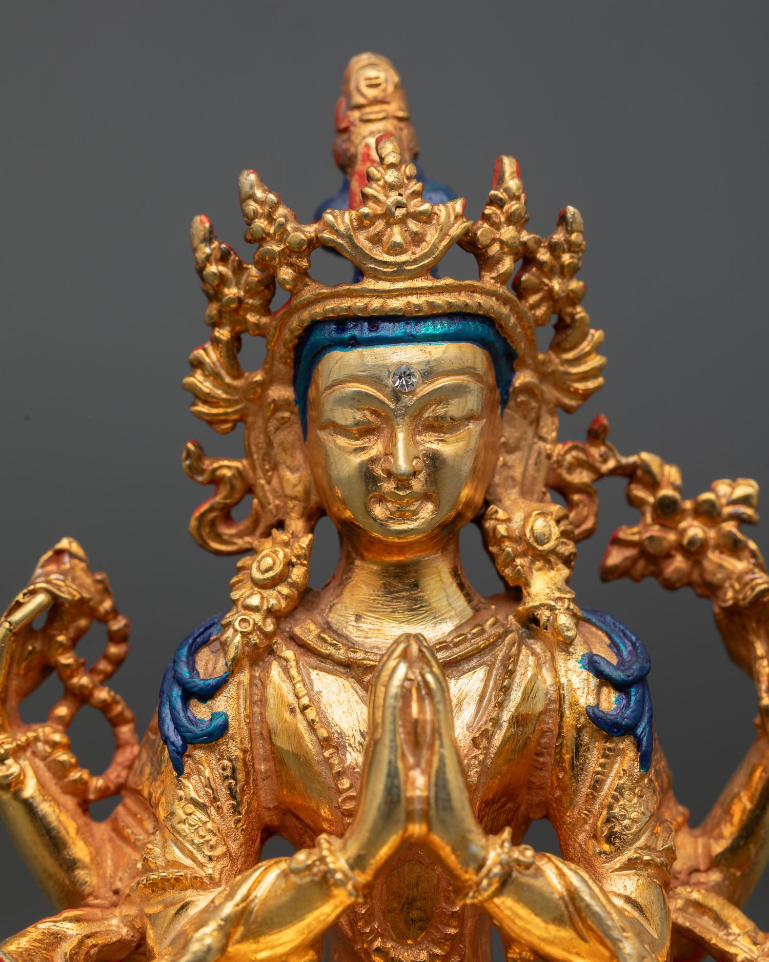 Chenrezig statue close up detailed Buddhist sculpture copper gold gilded craftsmanship