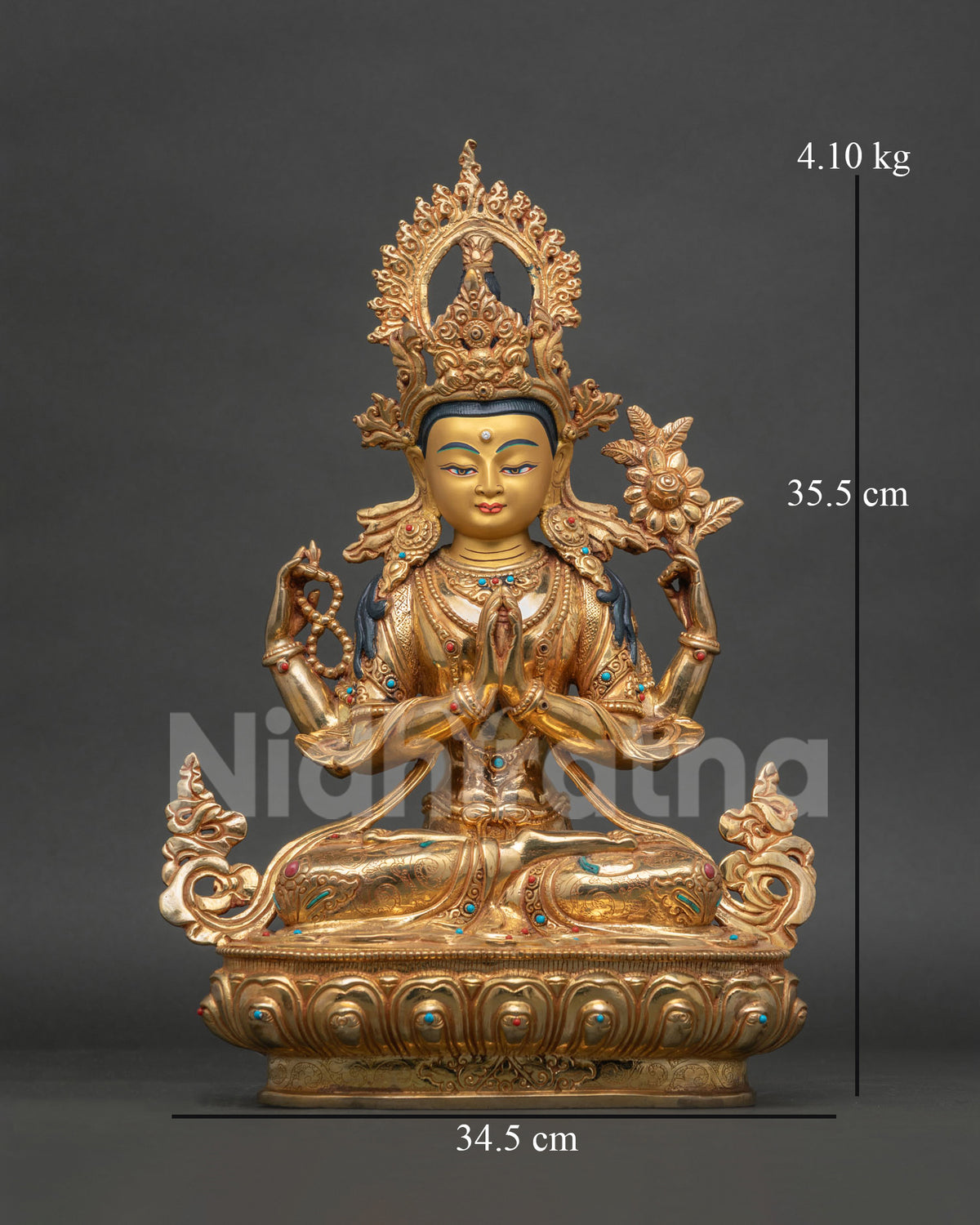 Chenrezig statue copper gold fire gilded 24k gold painted face Patan Nepal.