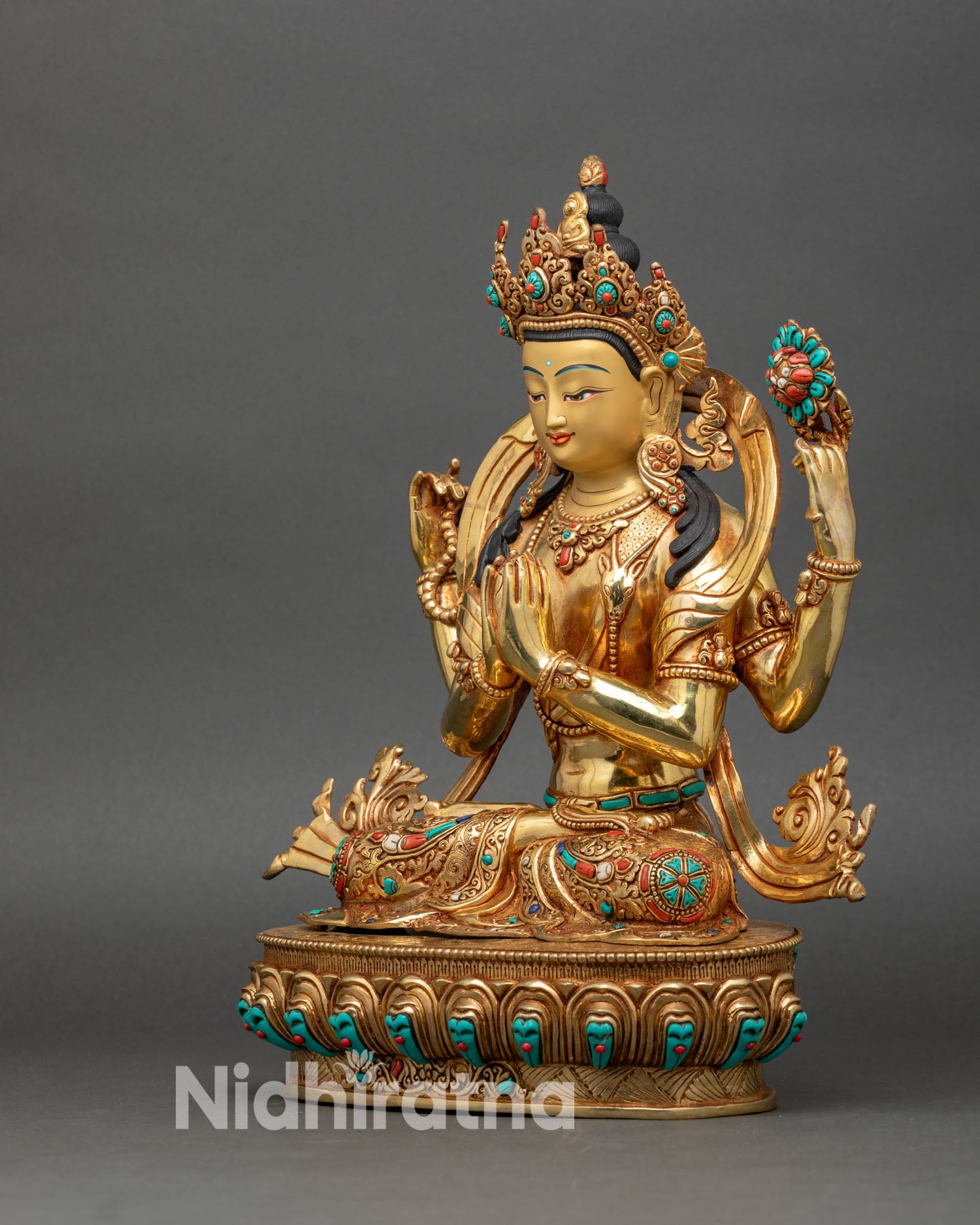 Chenrezig statue left side view with lotus flower and crystal mala