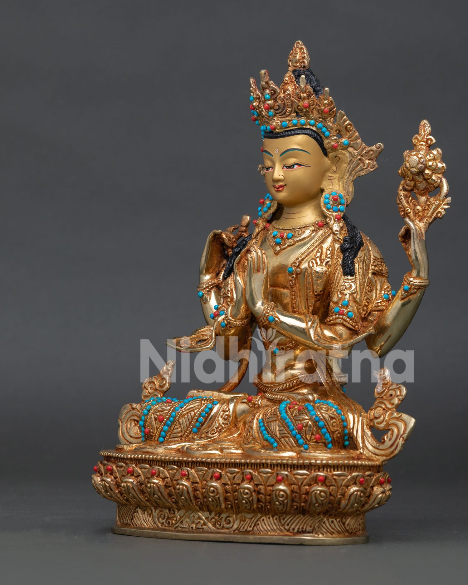 Chenrezig statue with Anjali Mudra, a wish-fulfilling jewel mala, and a lotus flower.