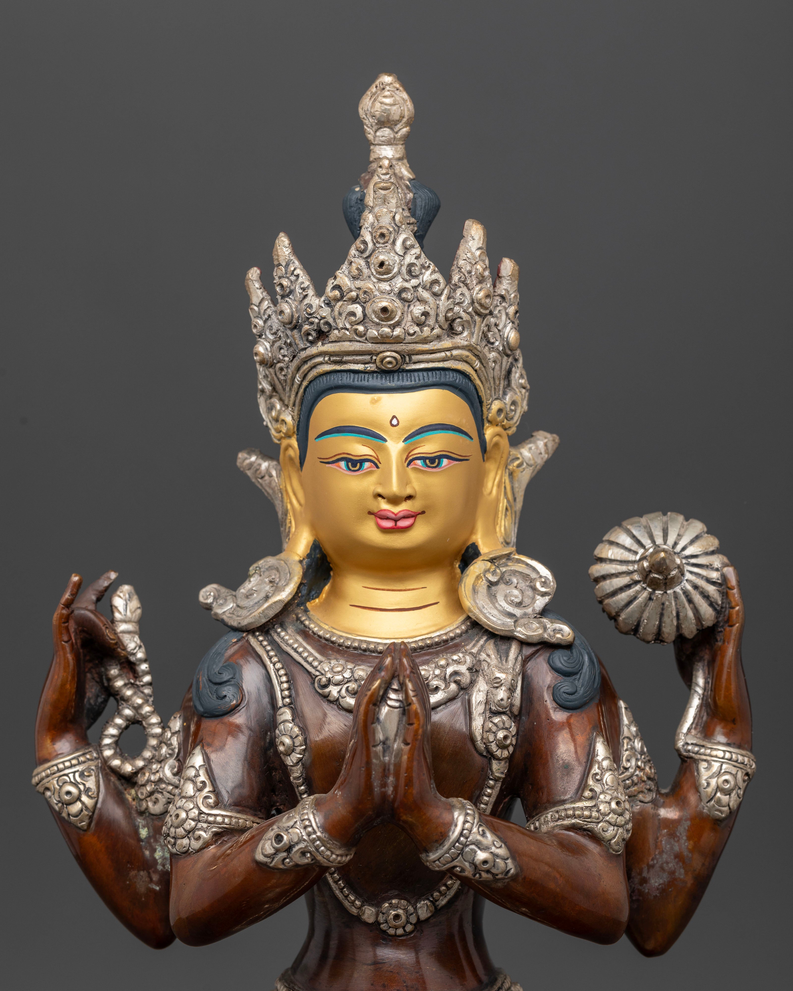 Chenrezig statue with oxidized, silver plated finish and 24K gold painted face