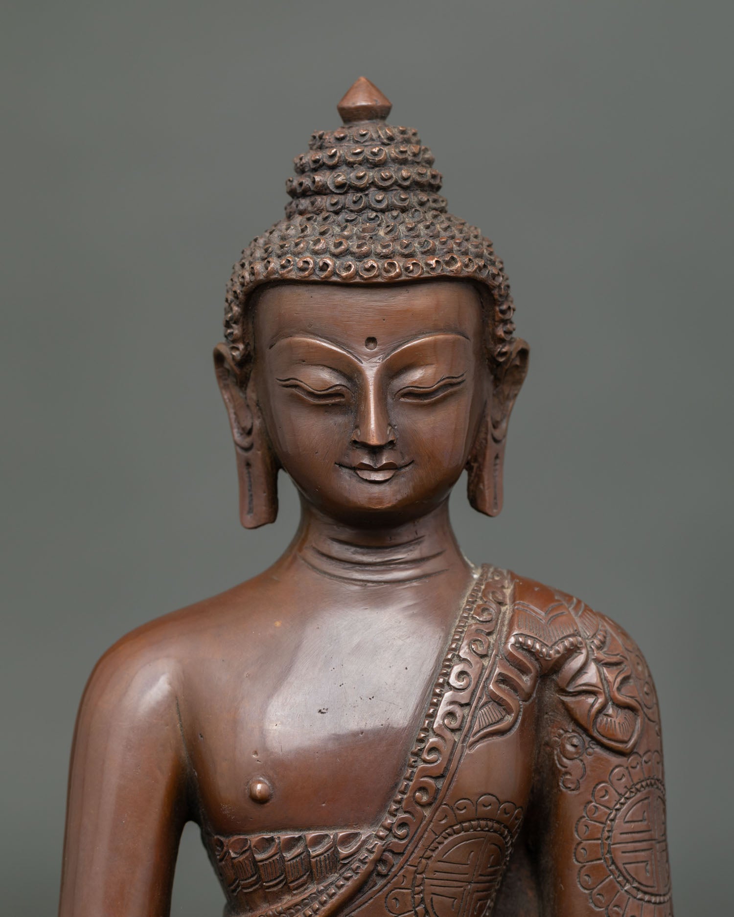 Close up Amitabha Buddha statue handcrafted Nepal copper fine repoussé details