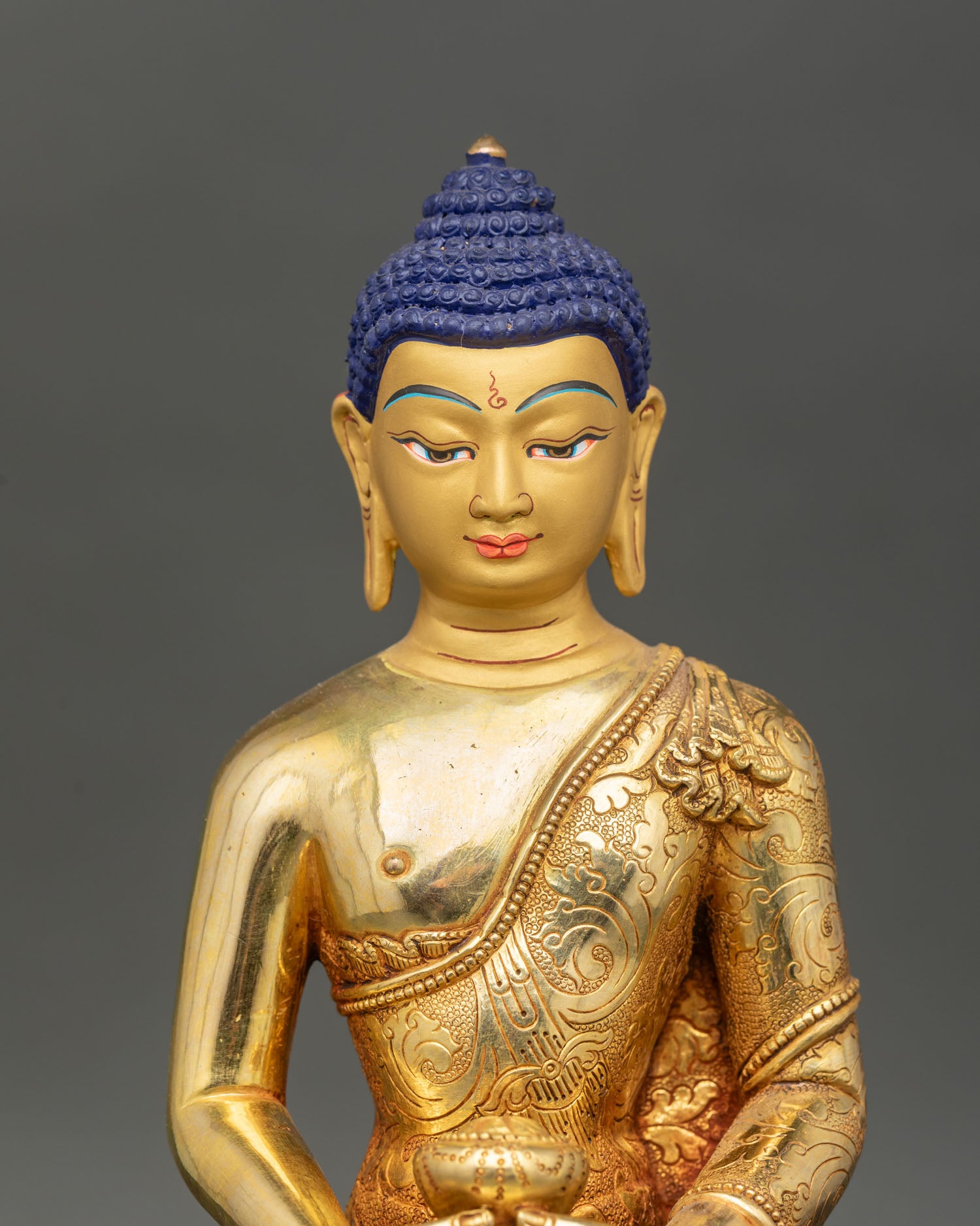 Close up Amitabha Buddha statue with serene gold face, radiating spiritual calm and sacred Buddhist art.