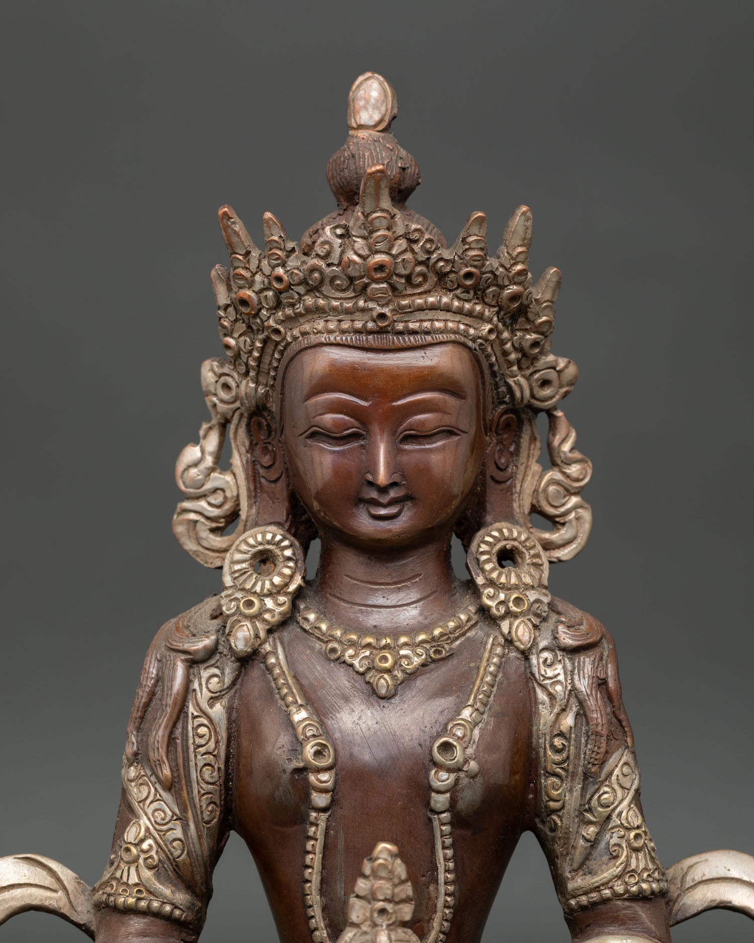 Close up Amitayus Statue copper craftsmanship antique finish and silver plated accents