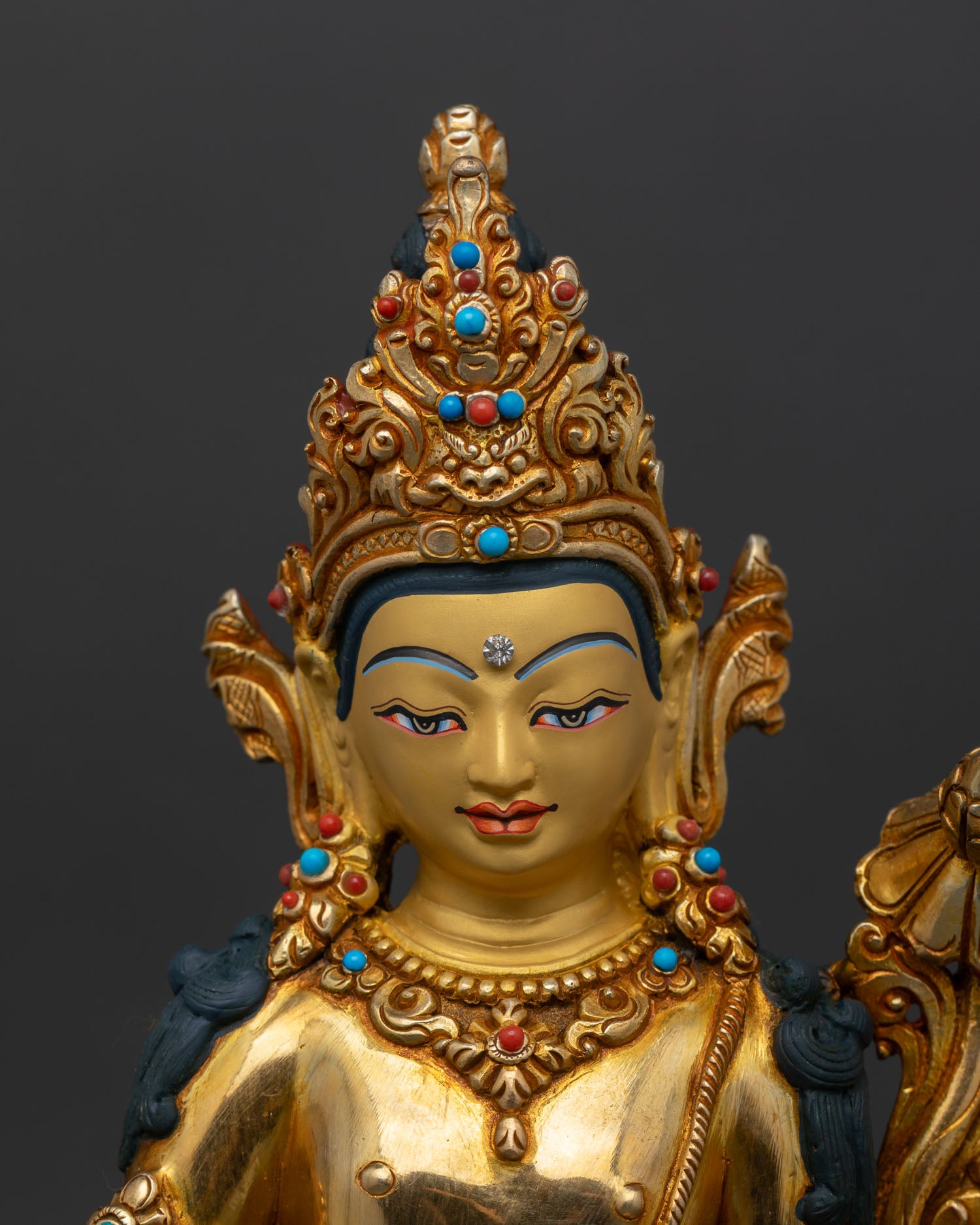 close up Avalokiteśvara face detail, jeweled crown, semi-precious stones, Buddhist sculpture